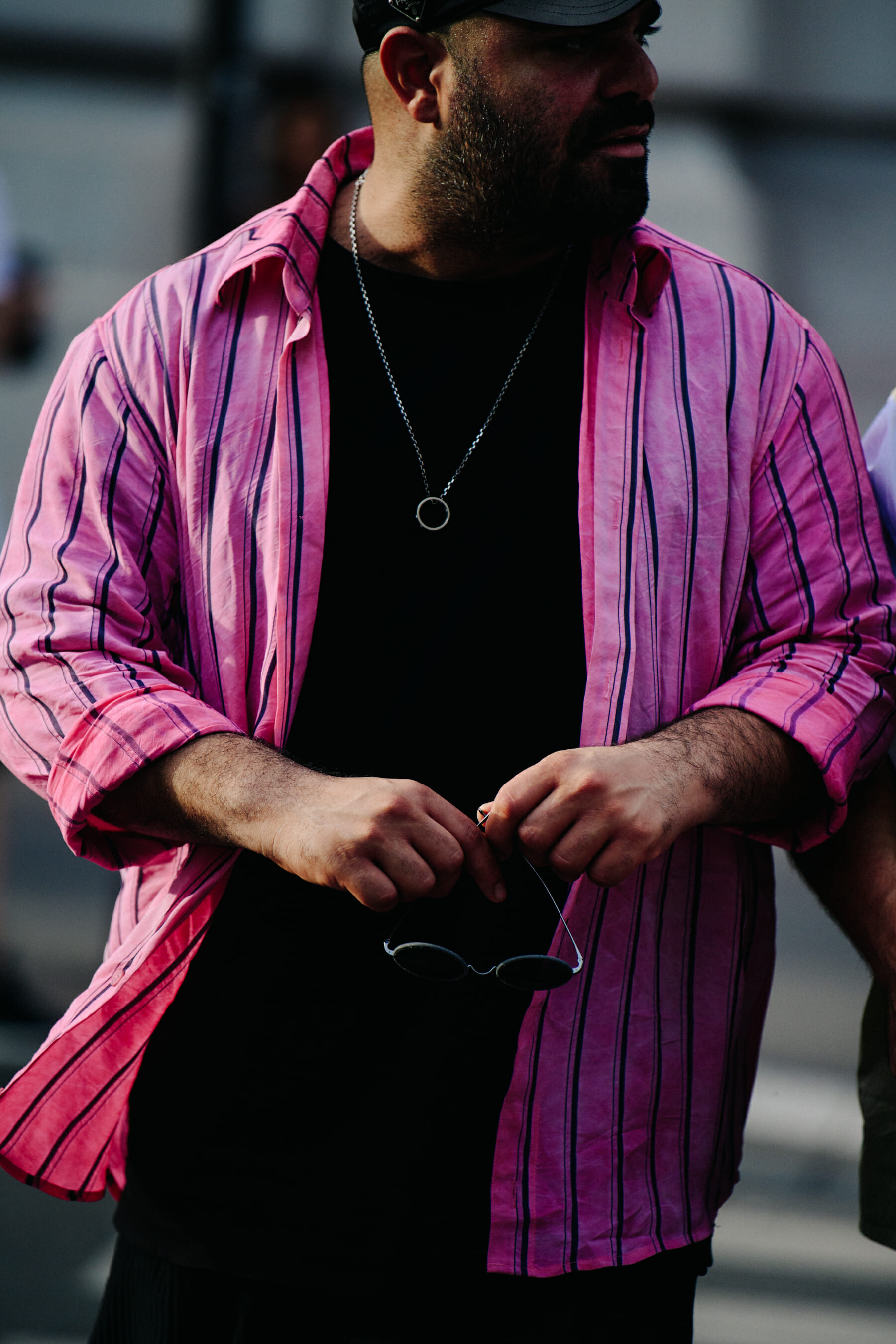 Man wearing pink stiped shirt