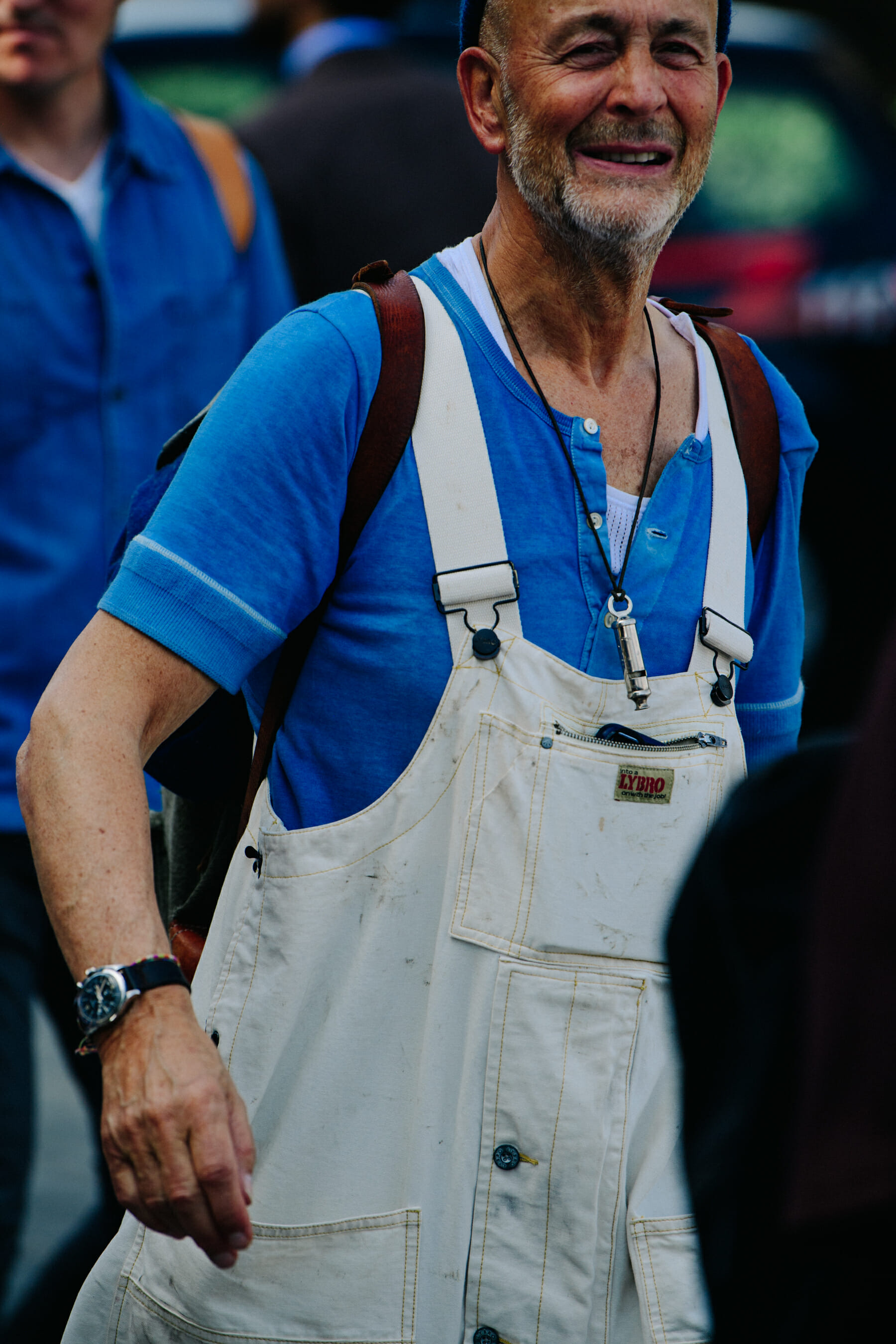 Man wearing white dungarees