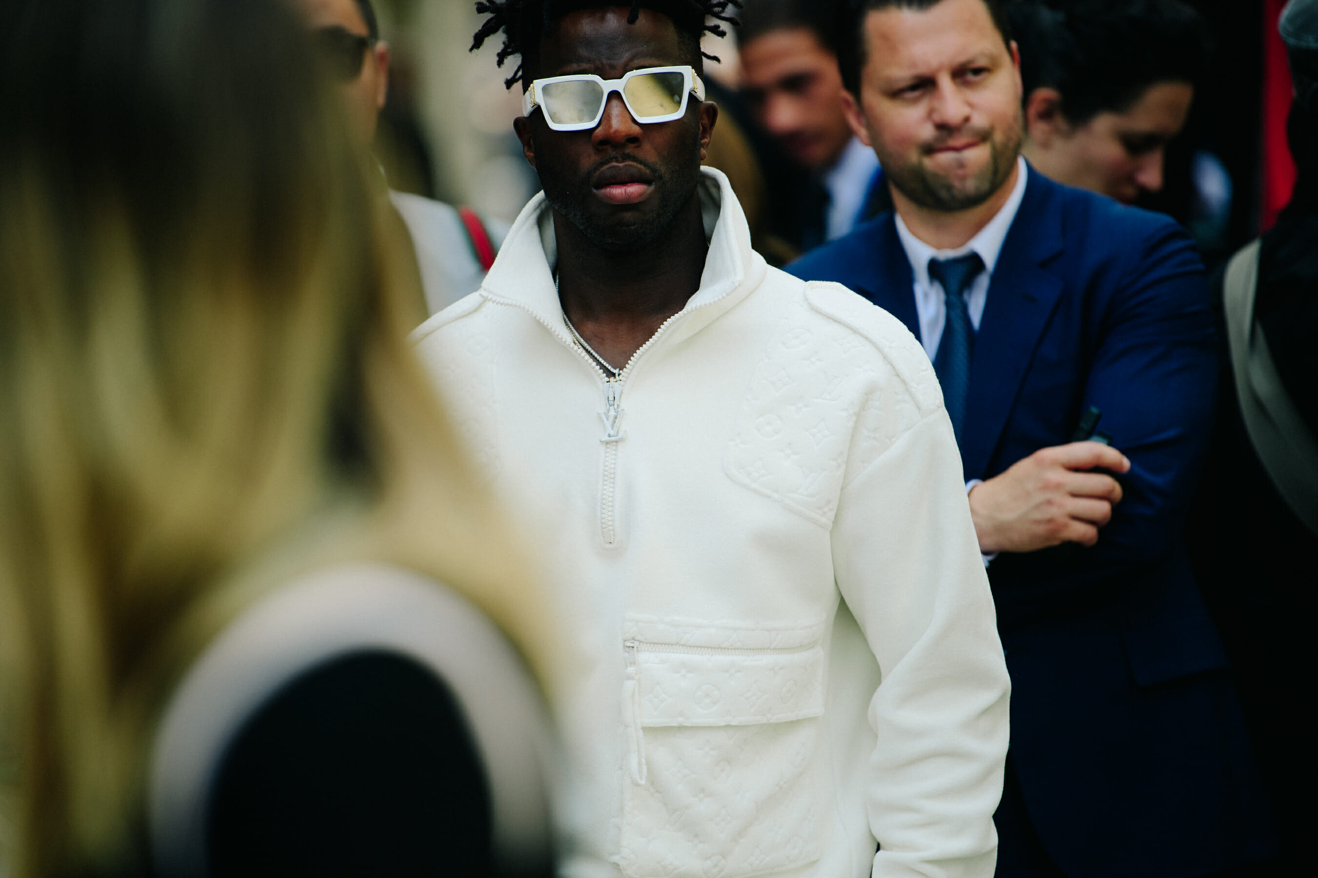Man wearing white Louis Vuitton jacket