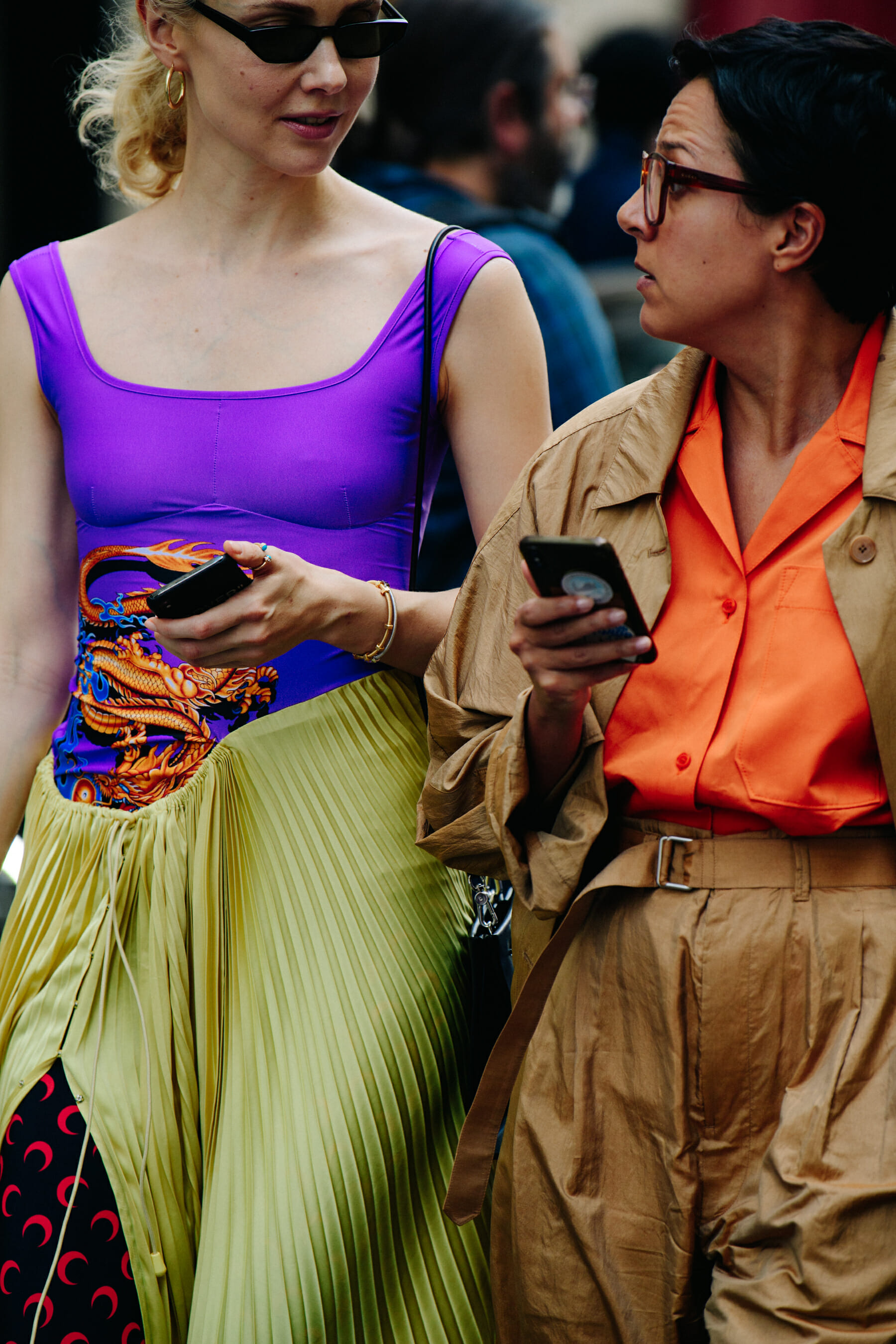 Two women wearing colourful shirts