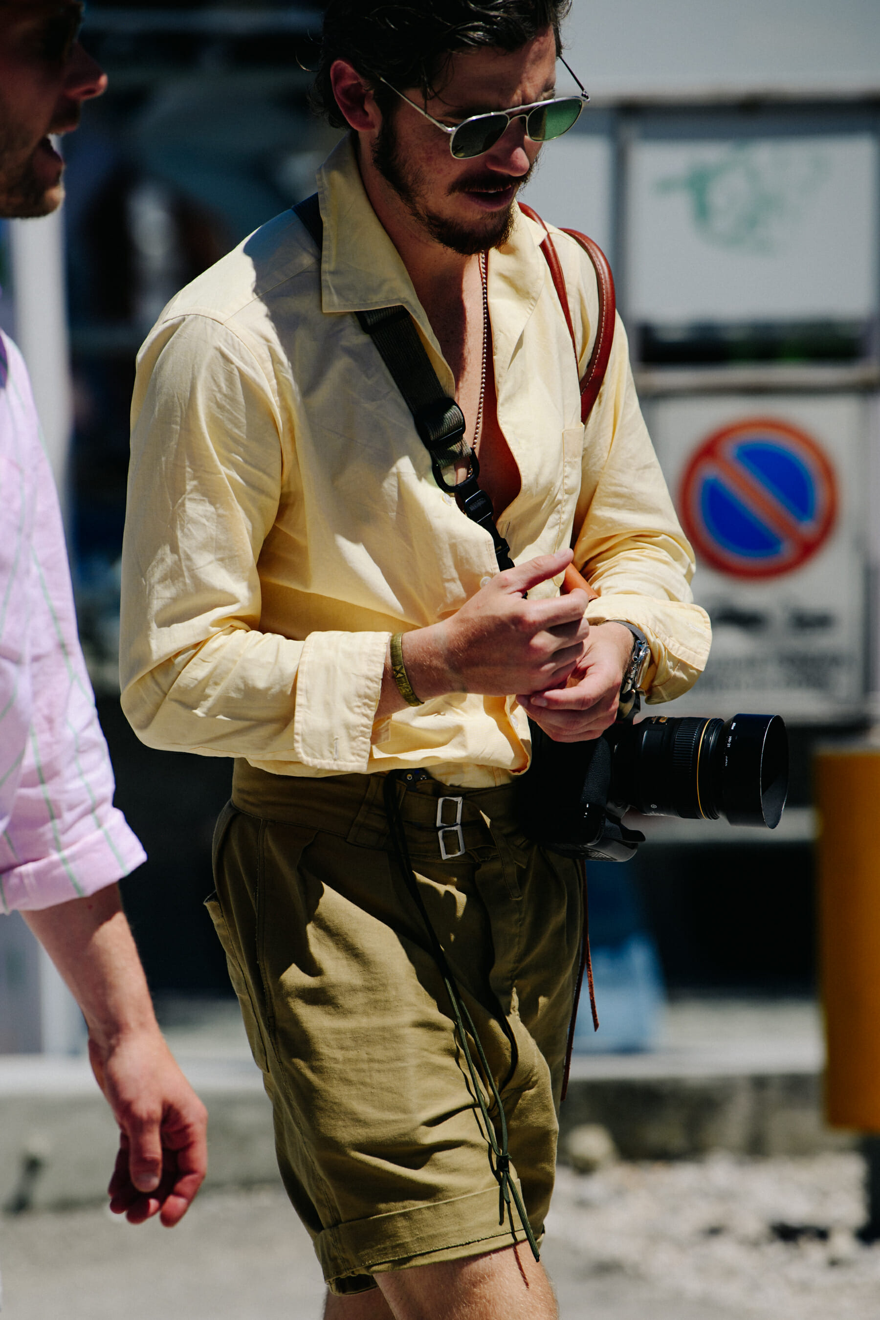 Man wearing yellow shirt