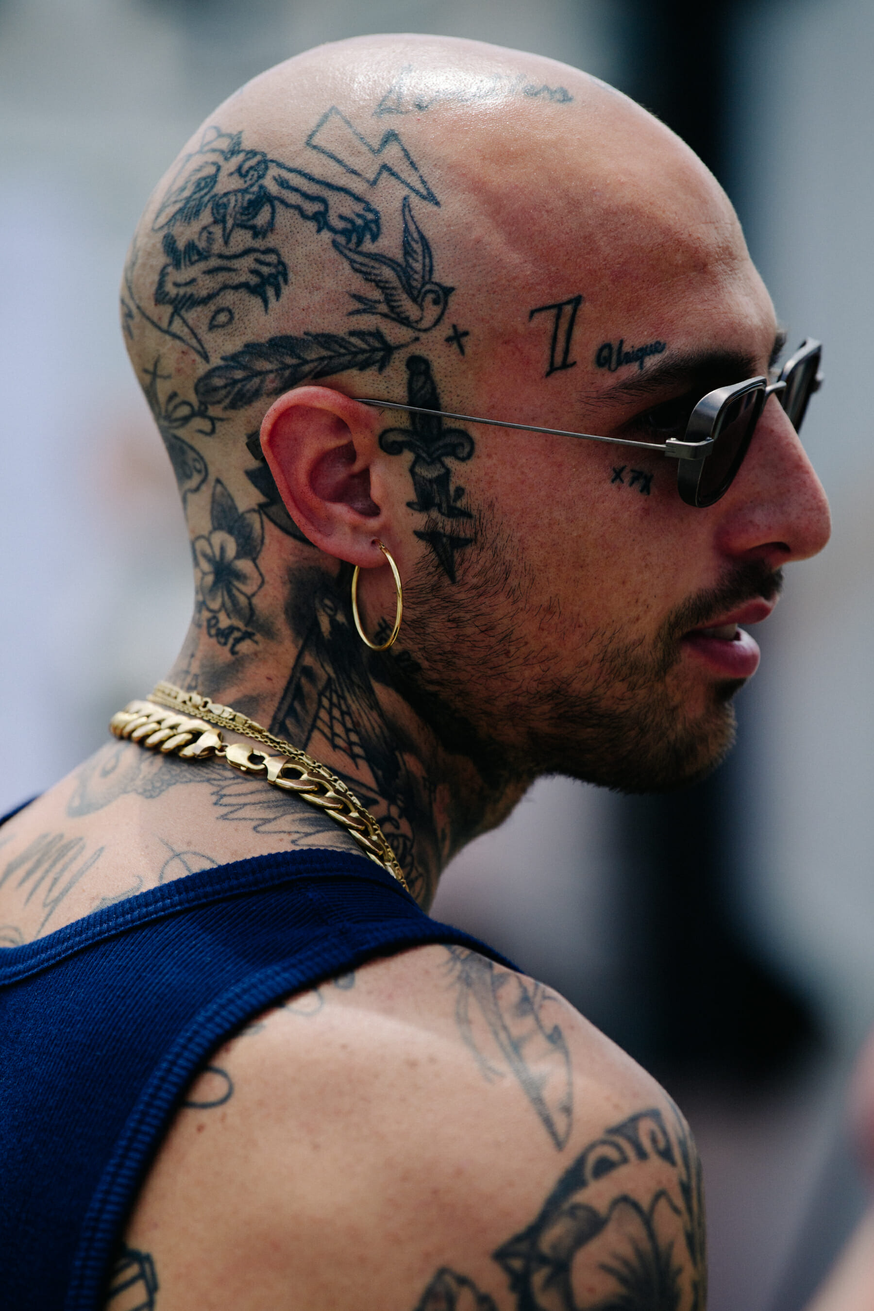 Tattooed man waring sunglasses