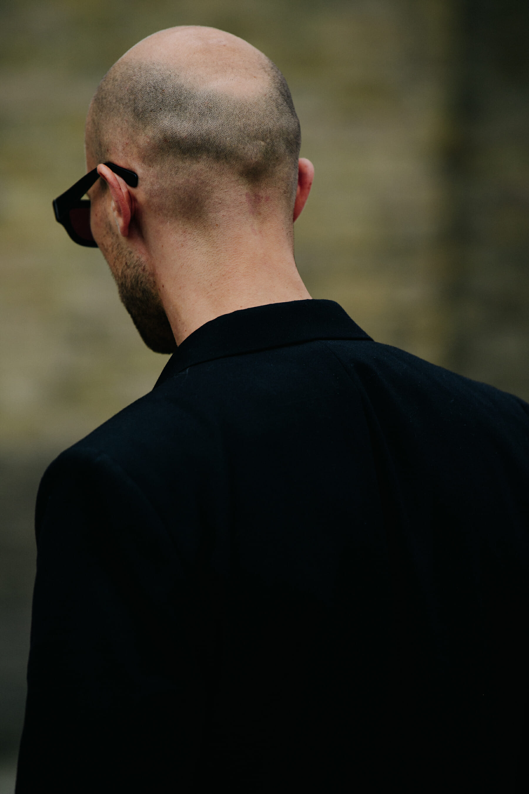 Man wearing black suit jacket