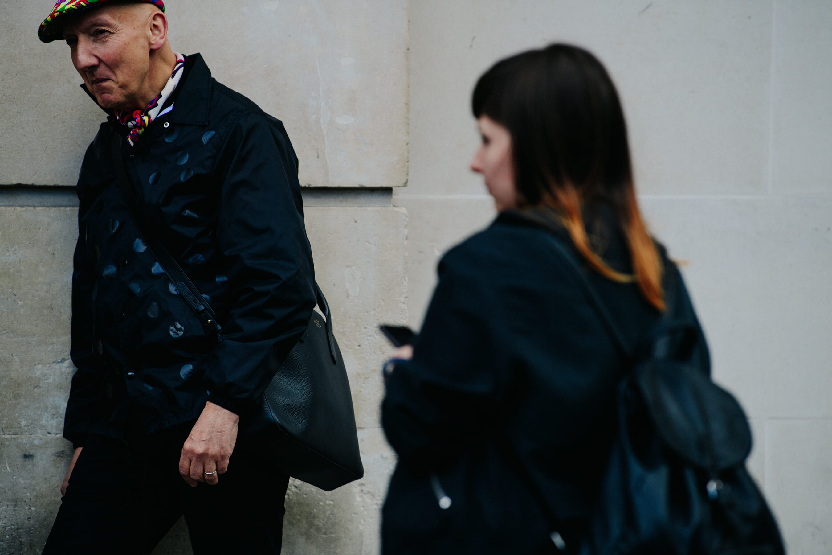 Man wearing black polka dot jacket