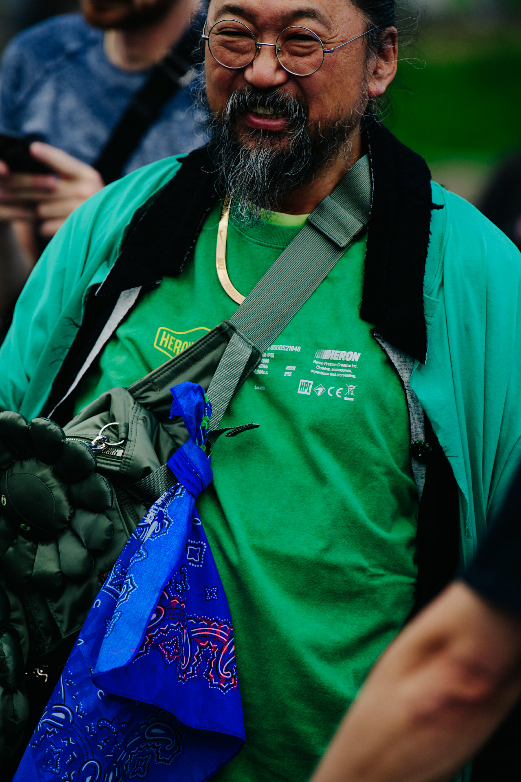 Man wearing green outfit