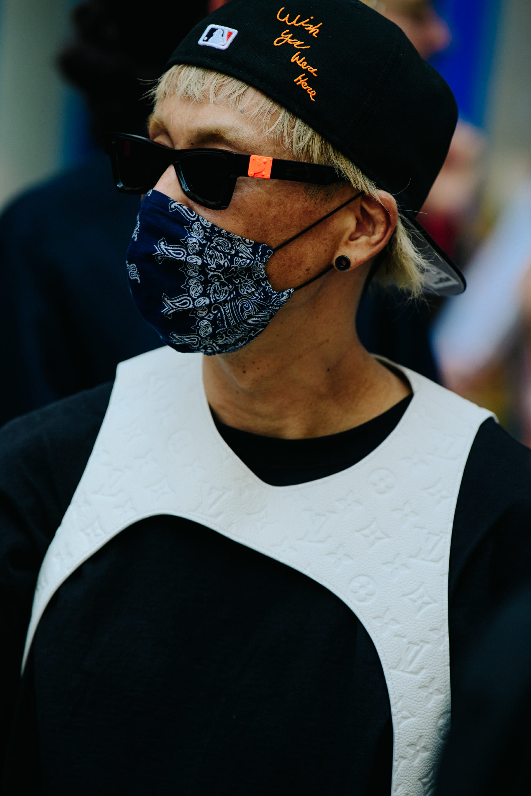 Man wearing Louis Vuitton sunglasses