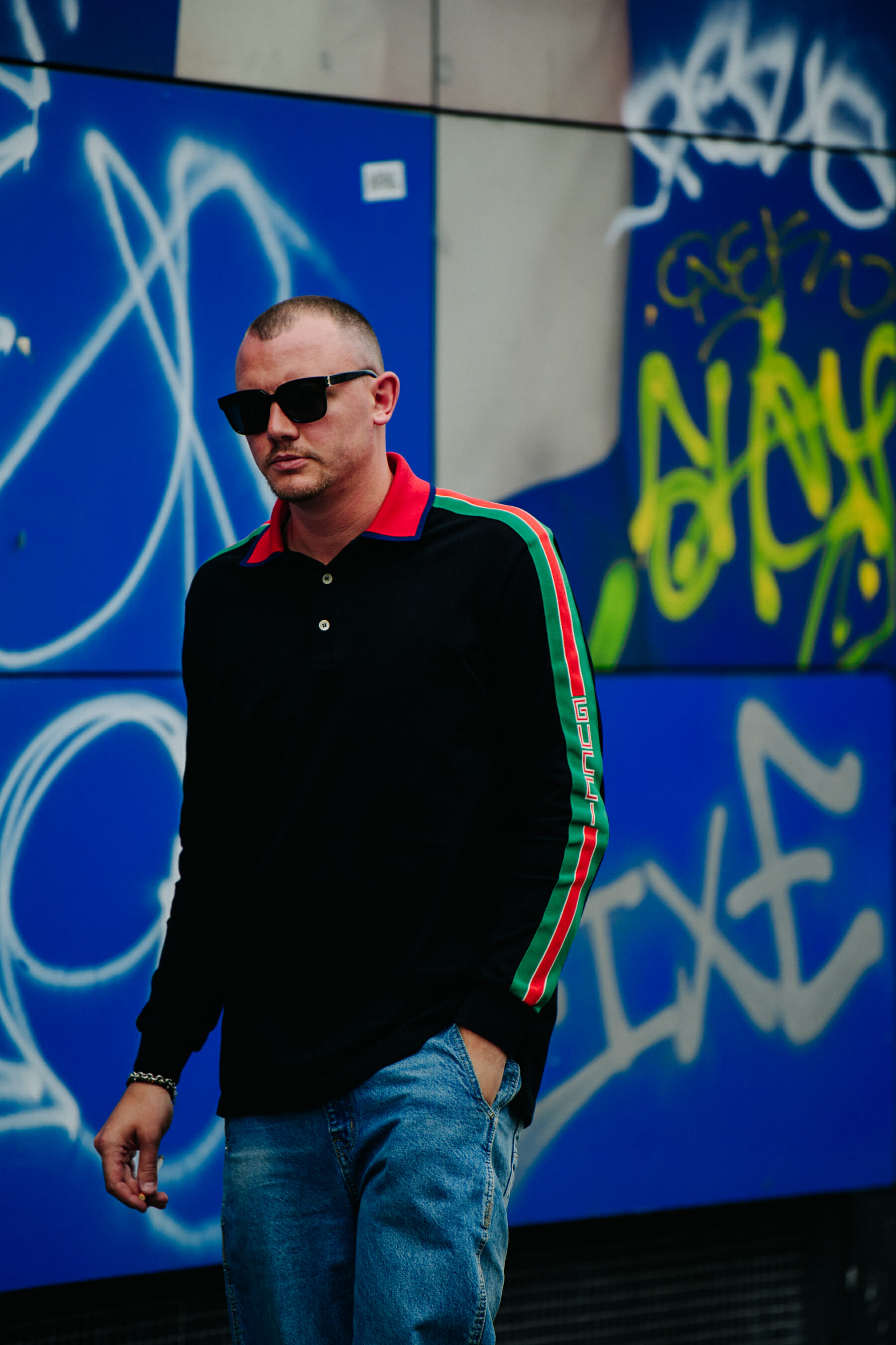 Man wearing Gucci shirt
