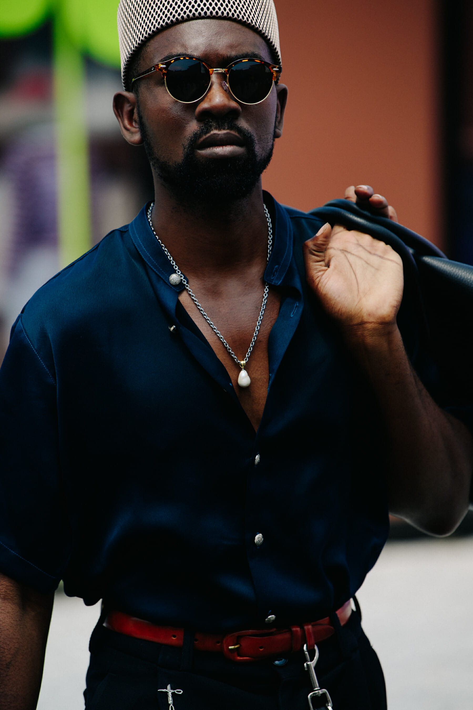 Man wearing dark open collar shirt