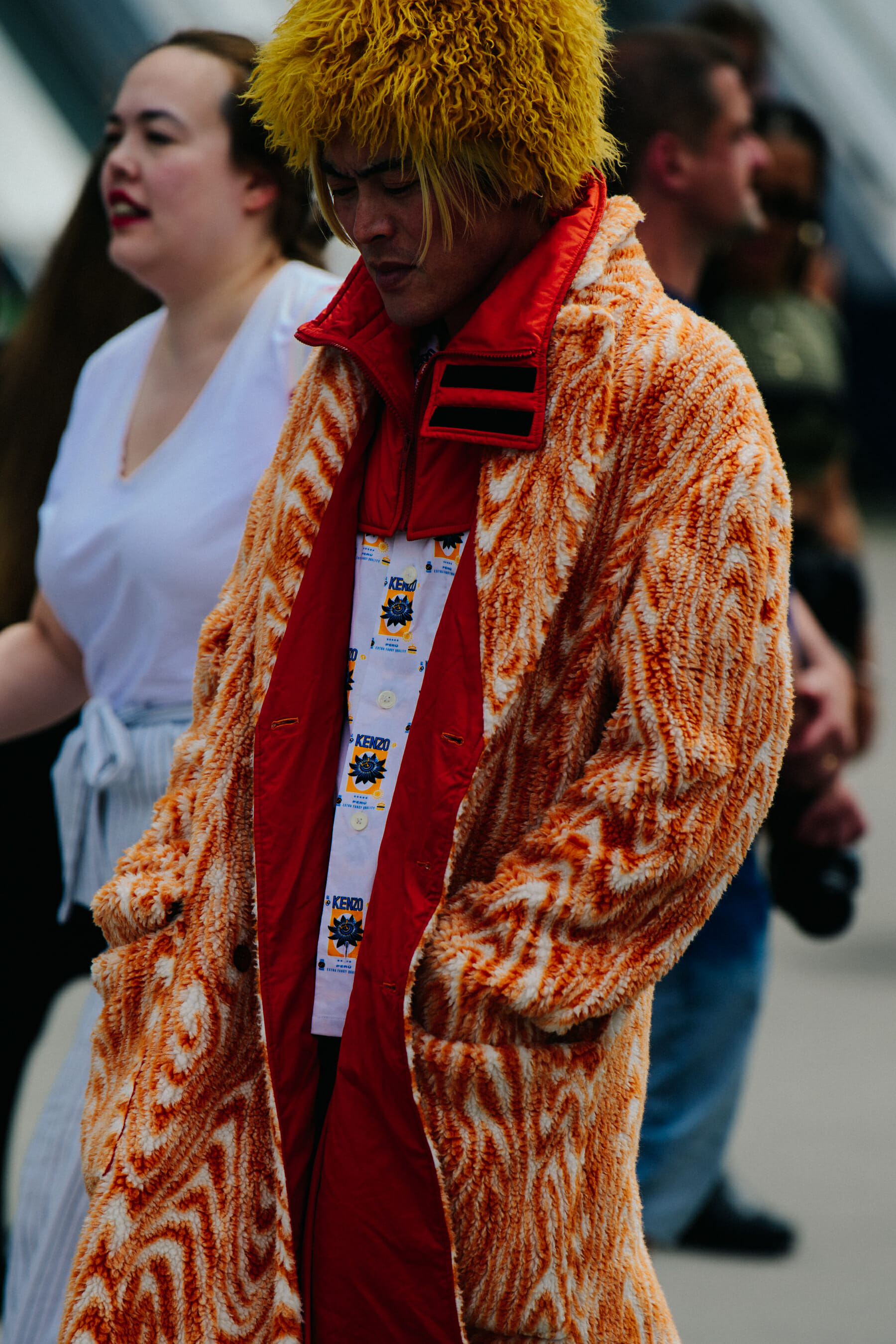 Man wearing fluffy orange jacket
