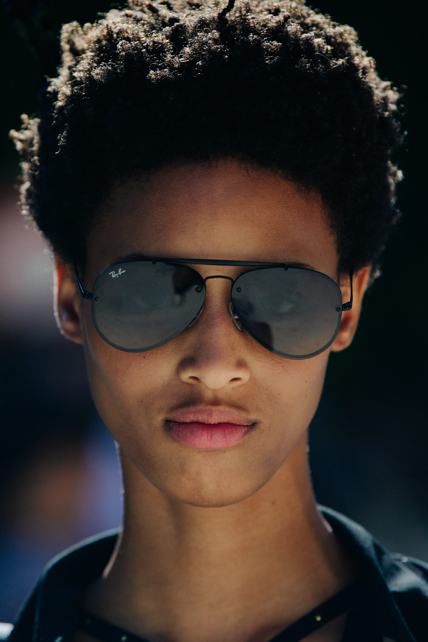 Portrait of model wearing Ray Ban sunglasses