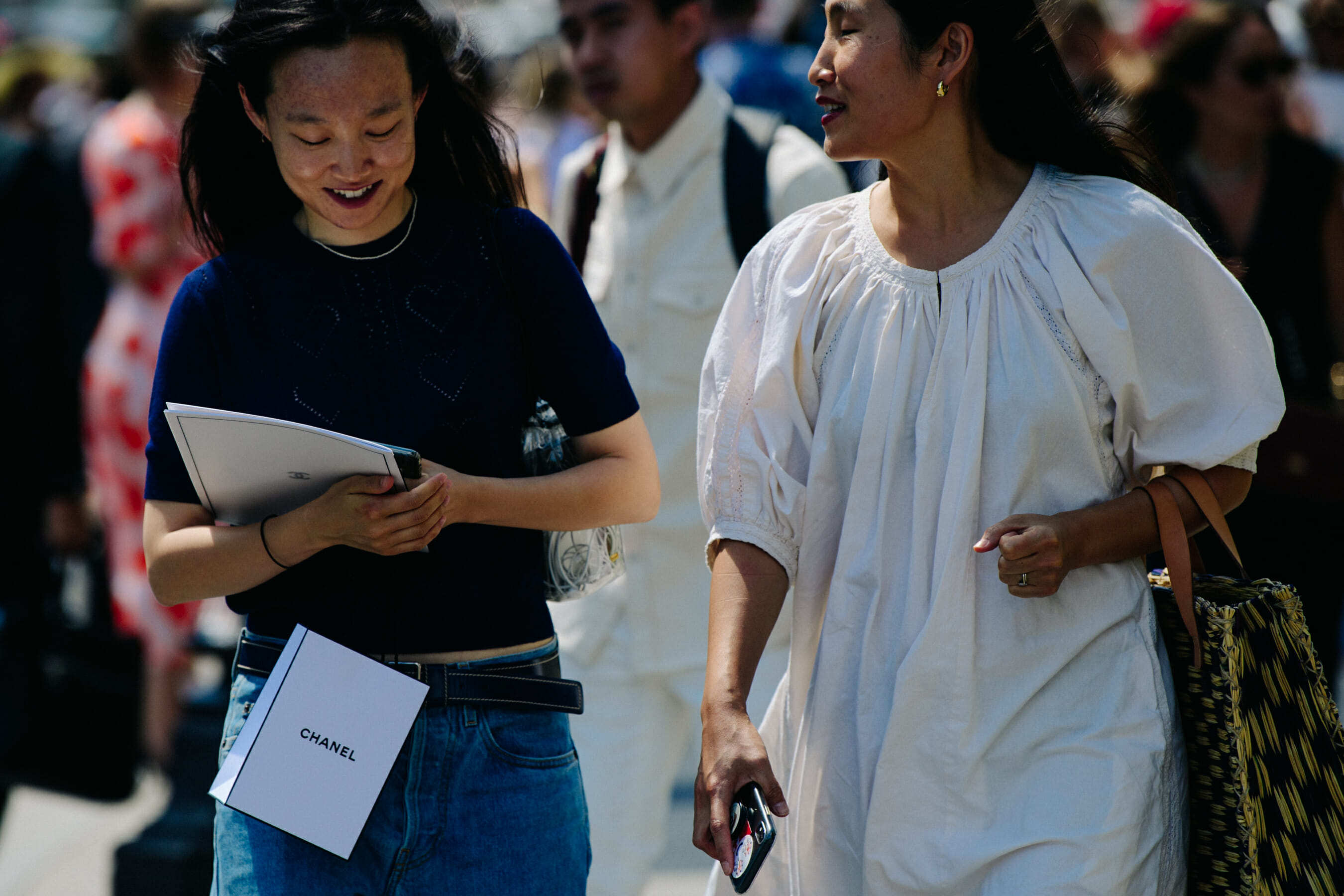 Two women wearing Chanel