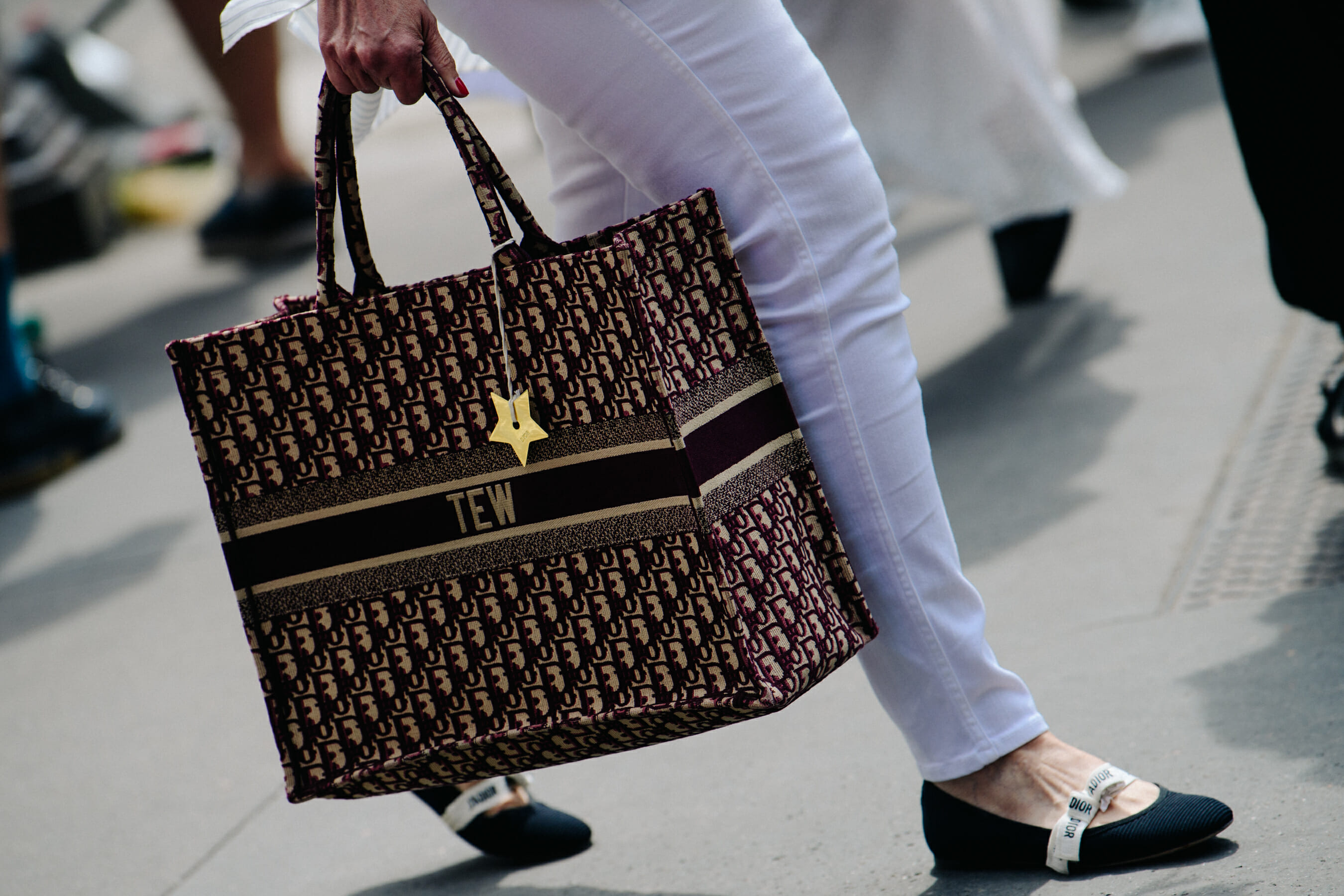 Woman carrying Christian Dior bag