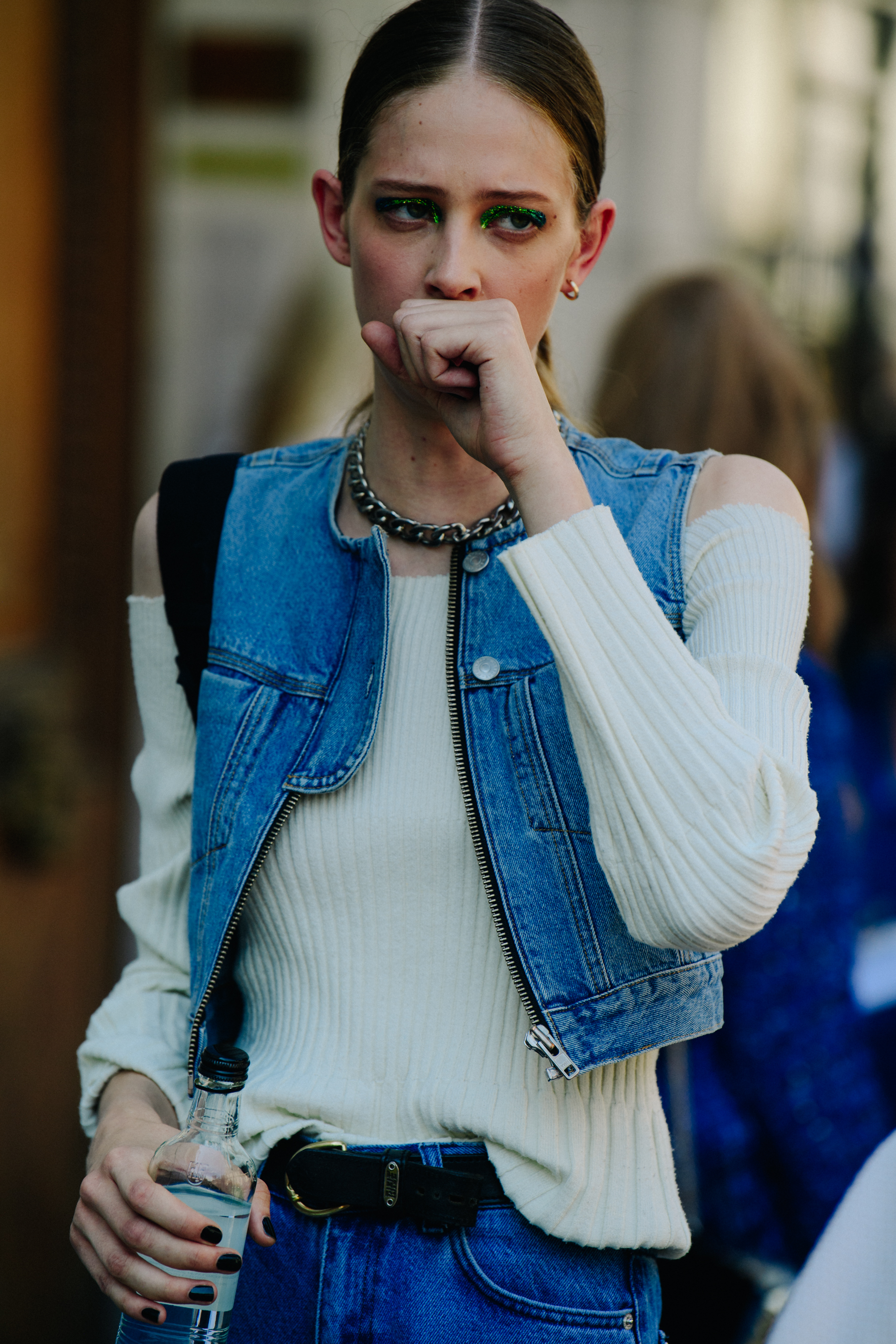 Model wearing denim vest