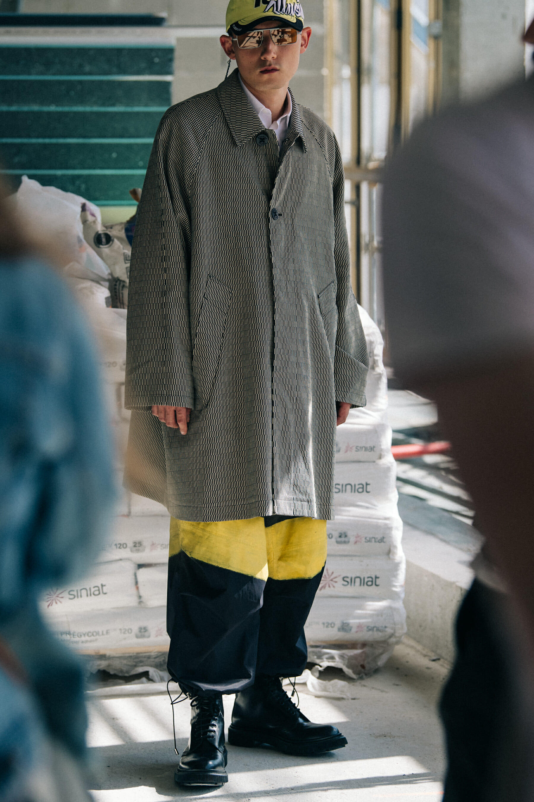 Model wearing cap at Etudes