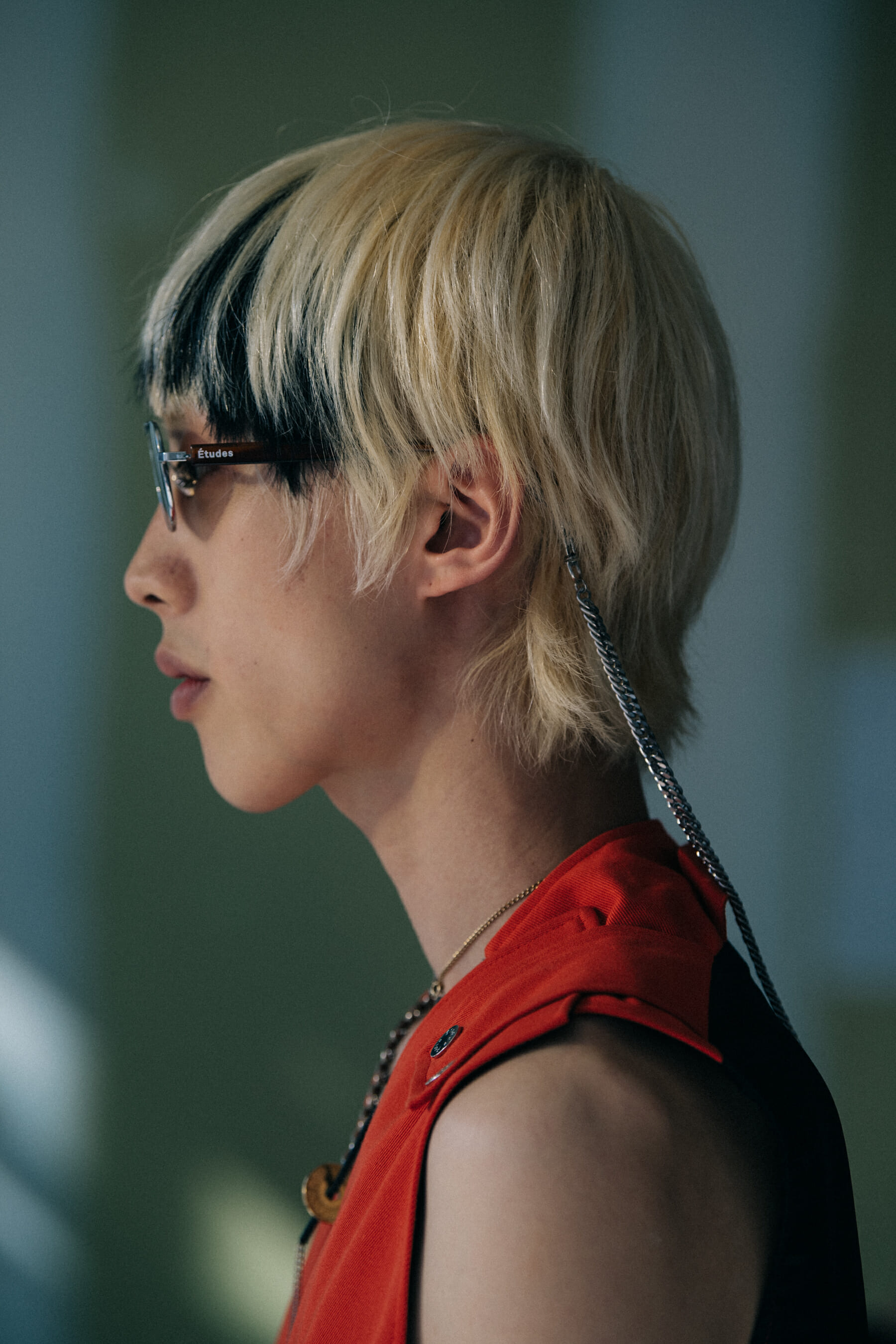 Model wearing red outfit at Etudes