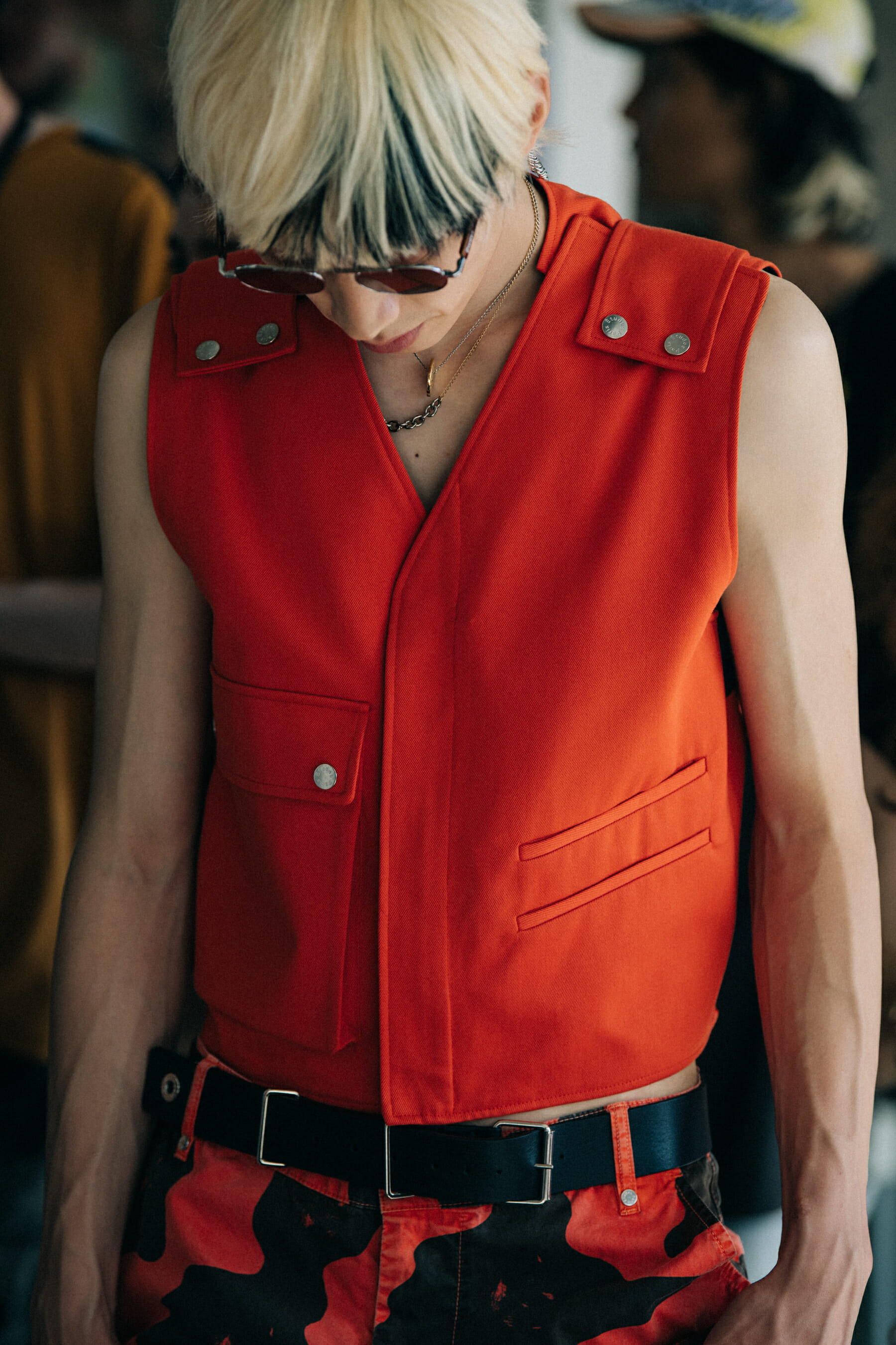 Model wearing red outfit at Etudes