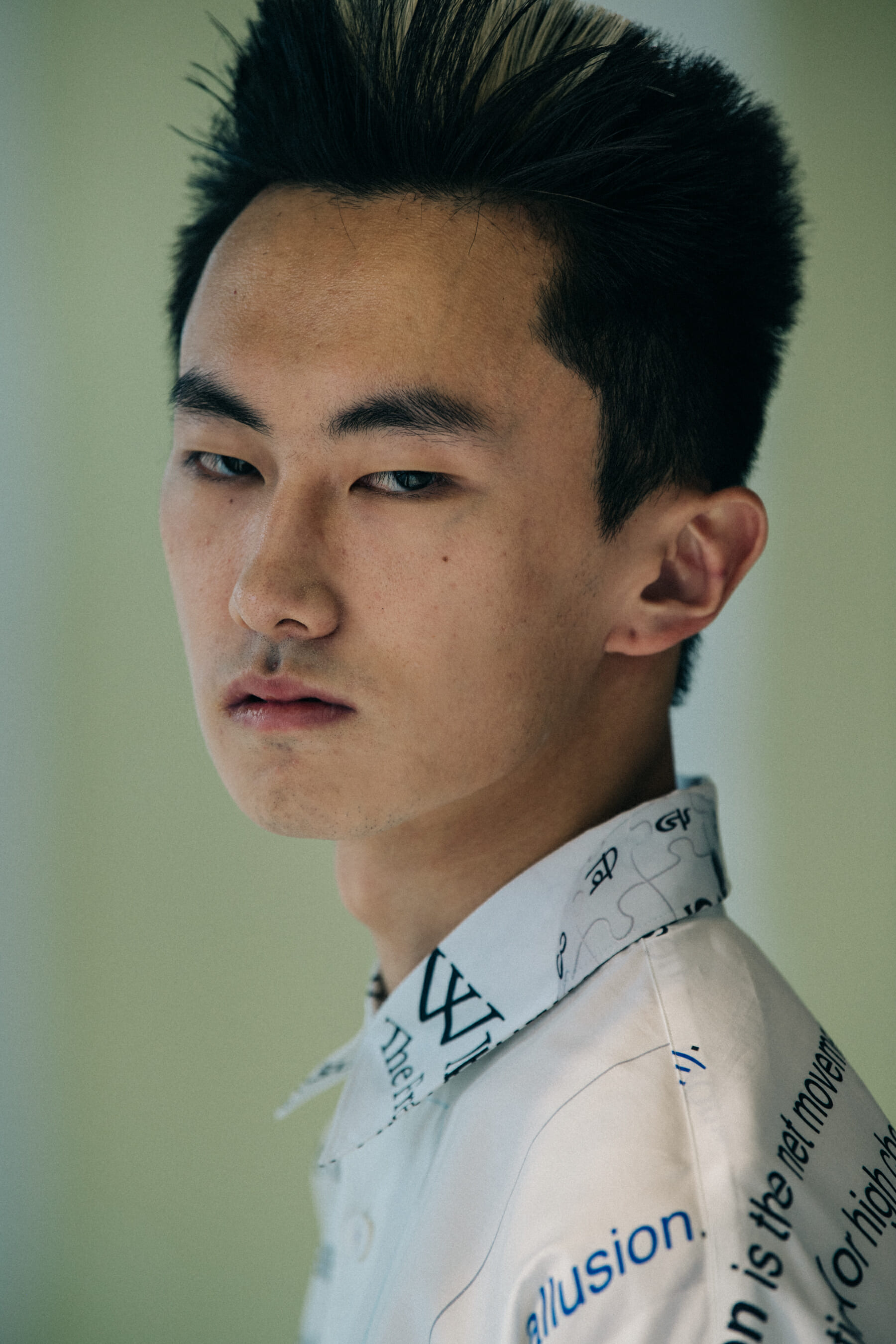 Model wearing white shirt at Etudes