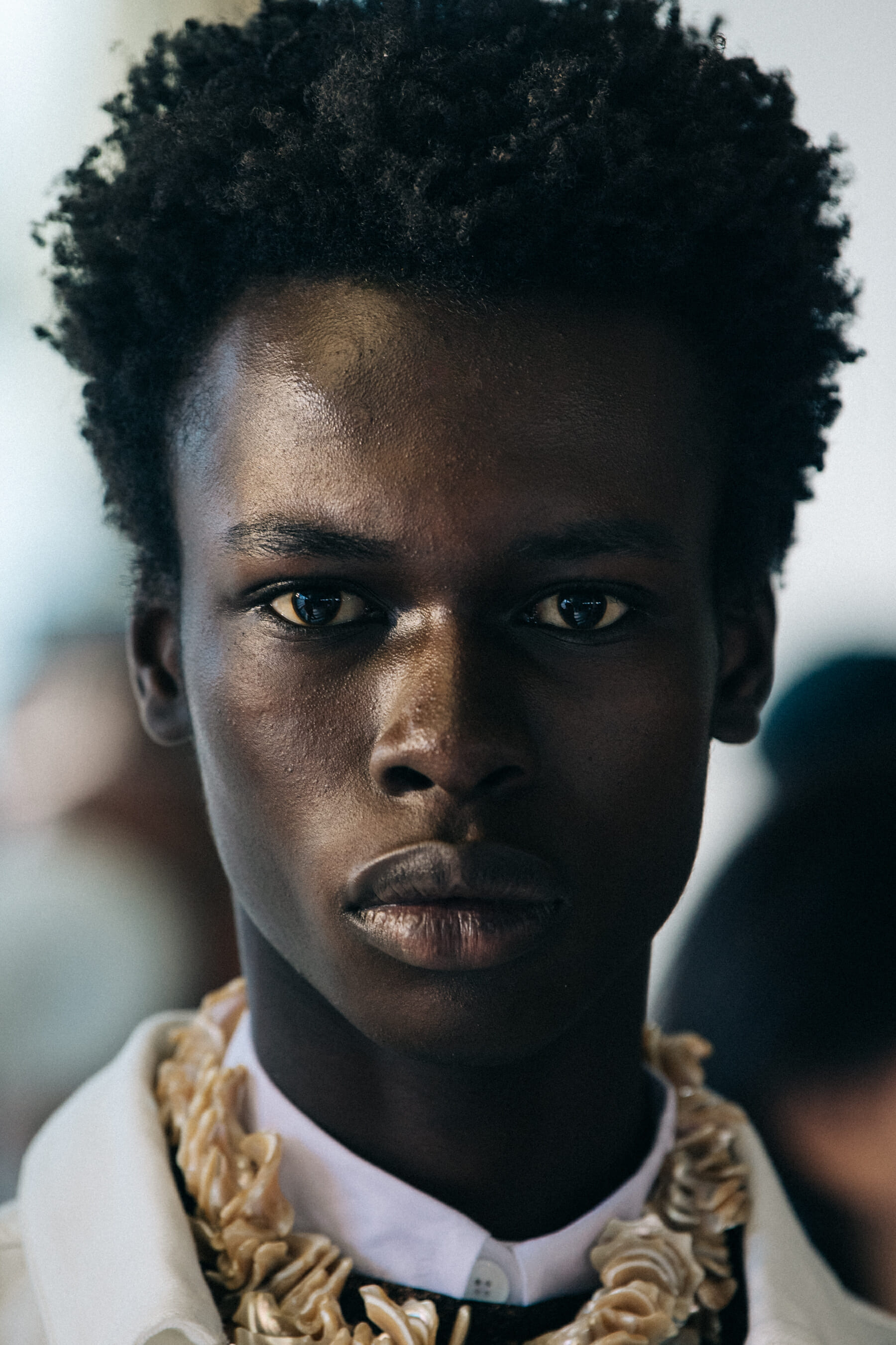 Portrait of model with short dark hair at Etudes