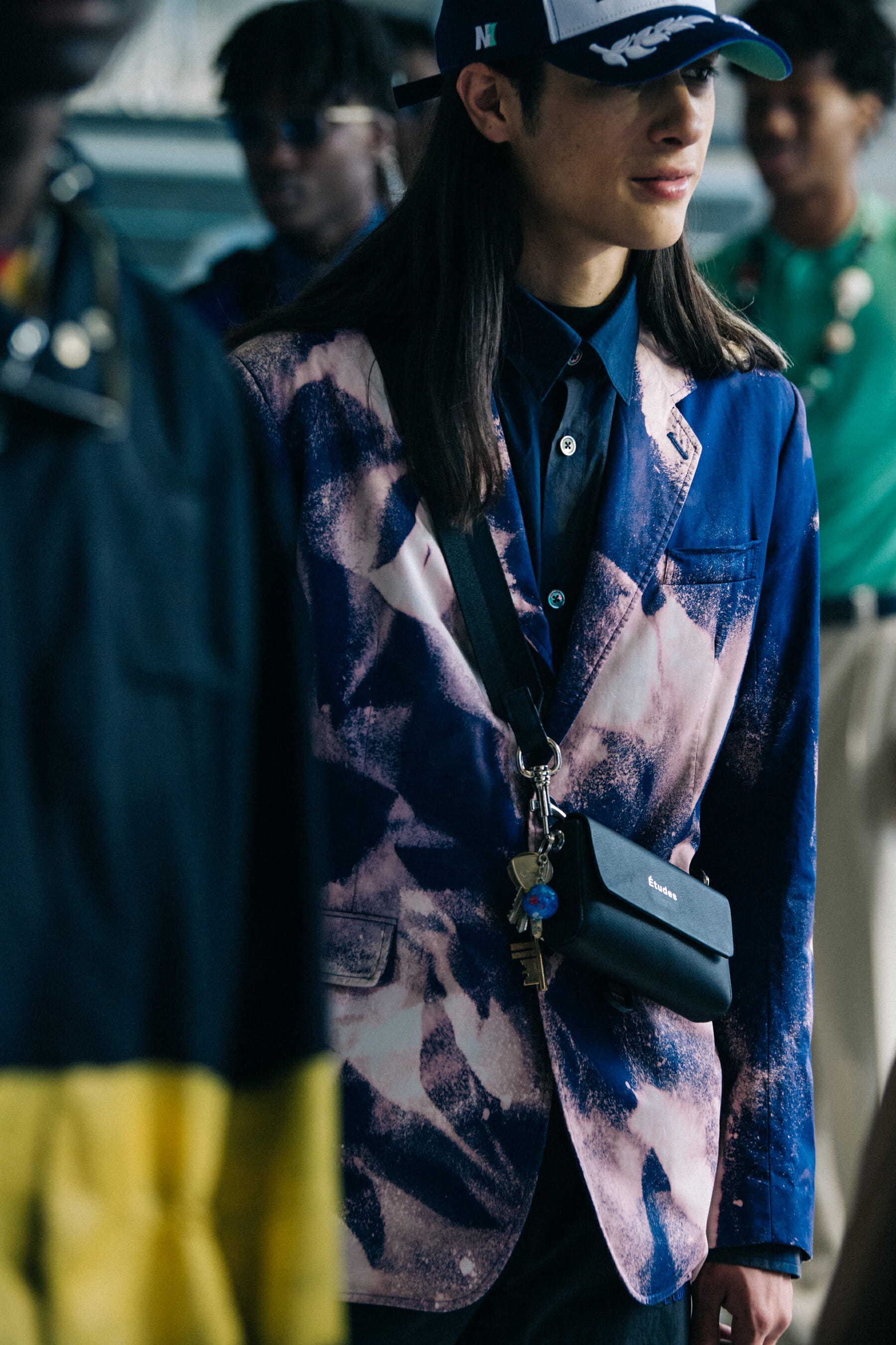 Model wearing cap at Etudes