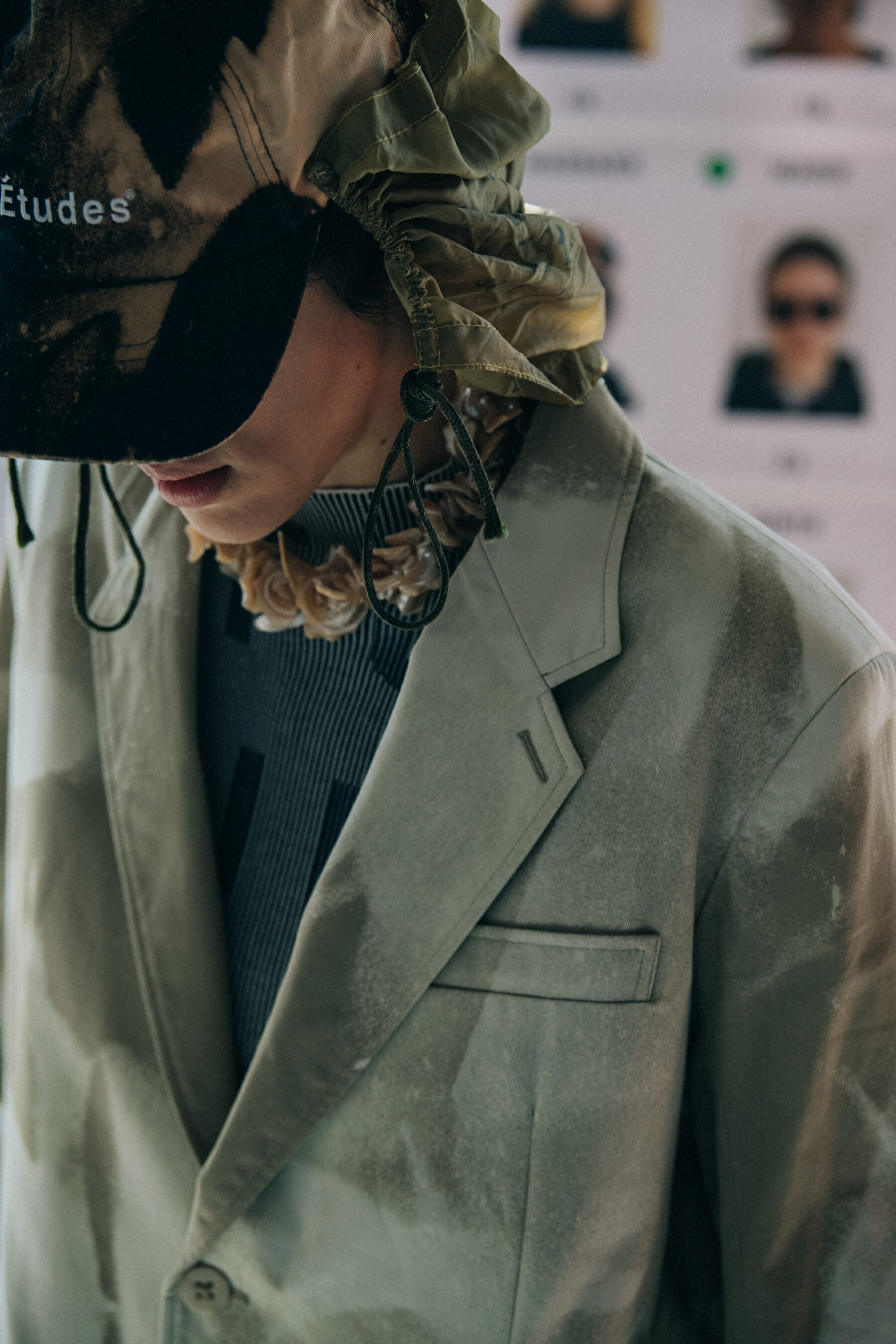Model wearing cap at Etudes
