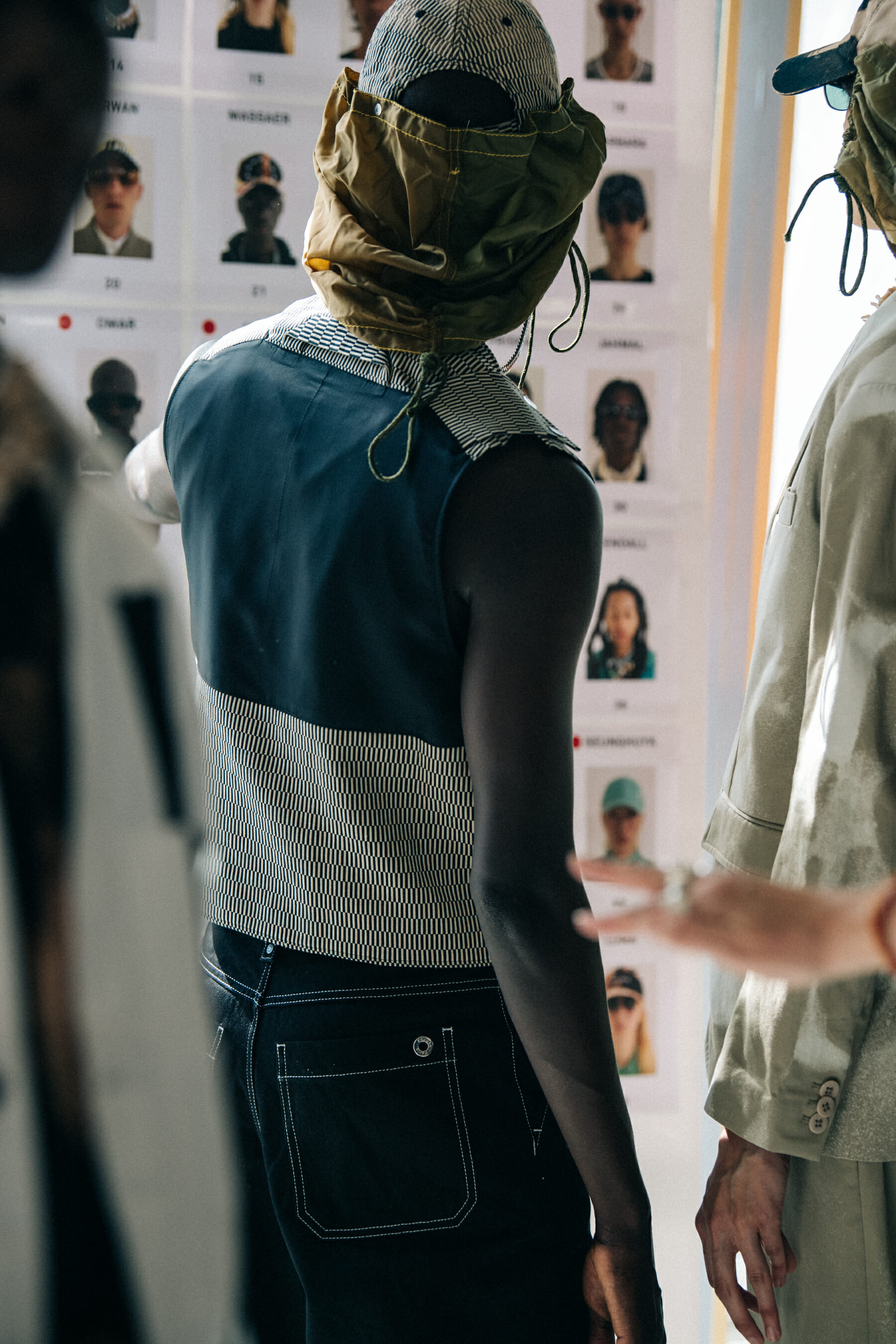 Model wearing cap at Etudes