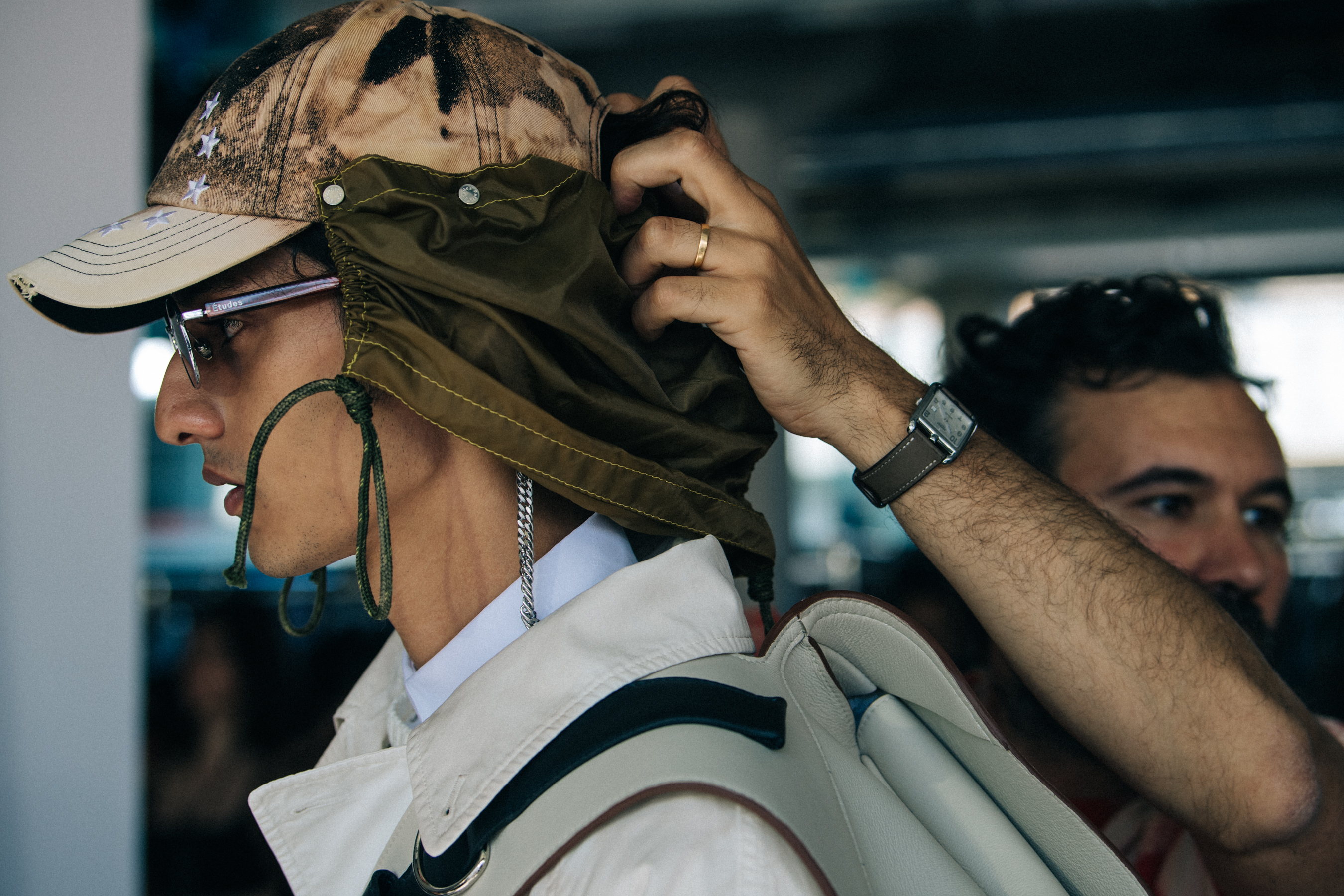 Model wearing cap at Etudes
