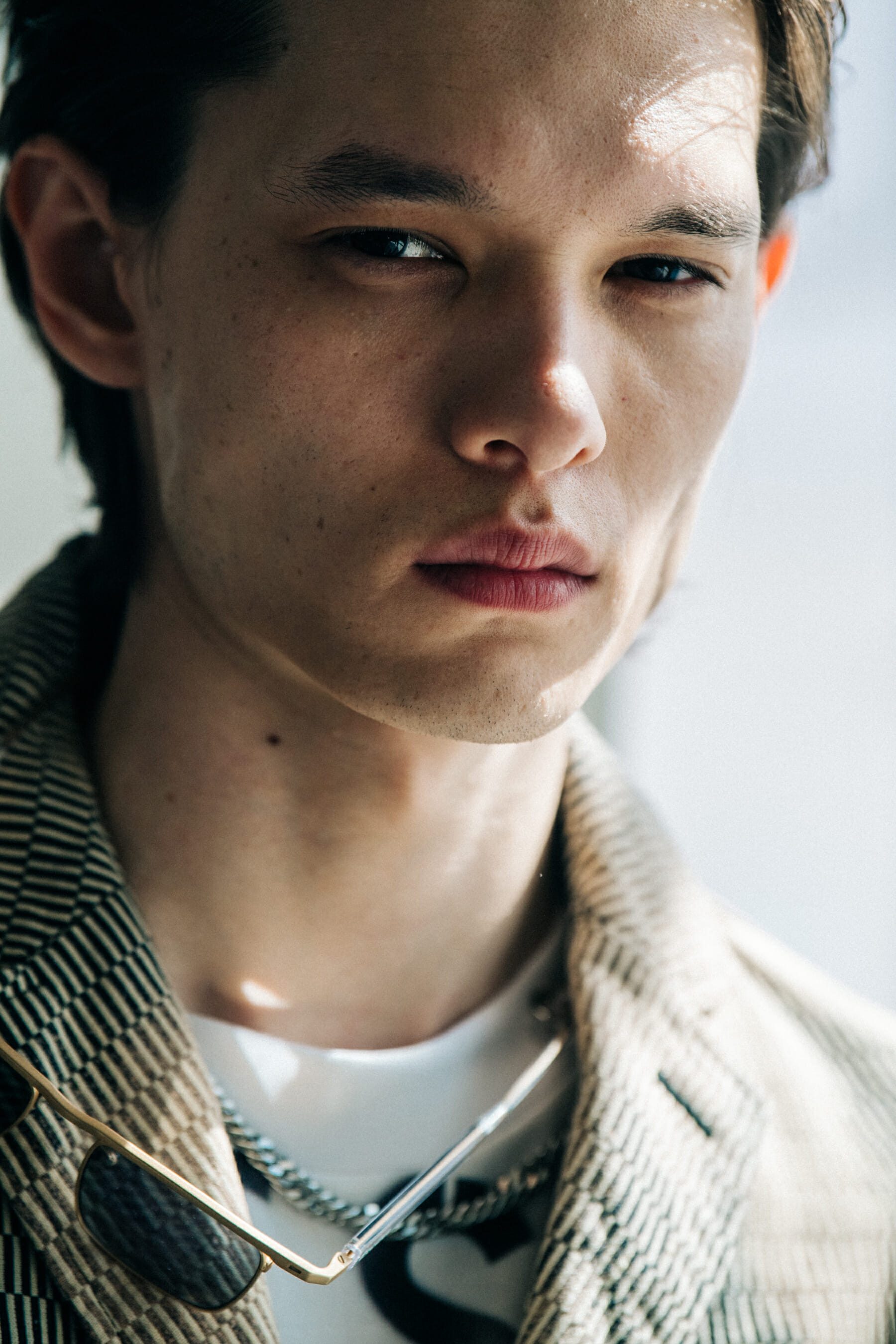 Model wearing light outfit at Etudes