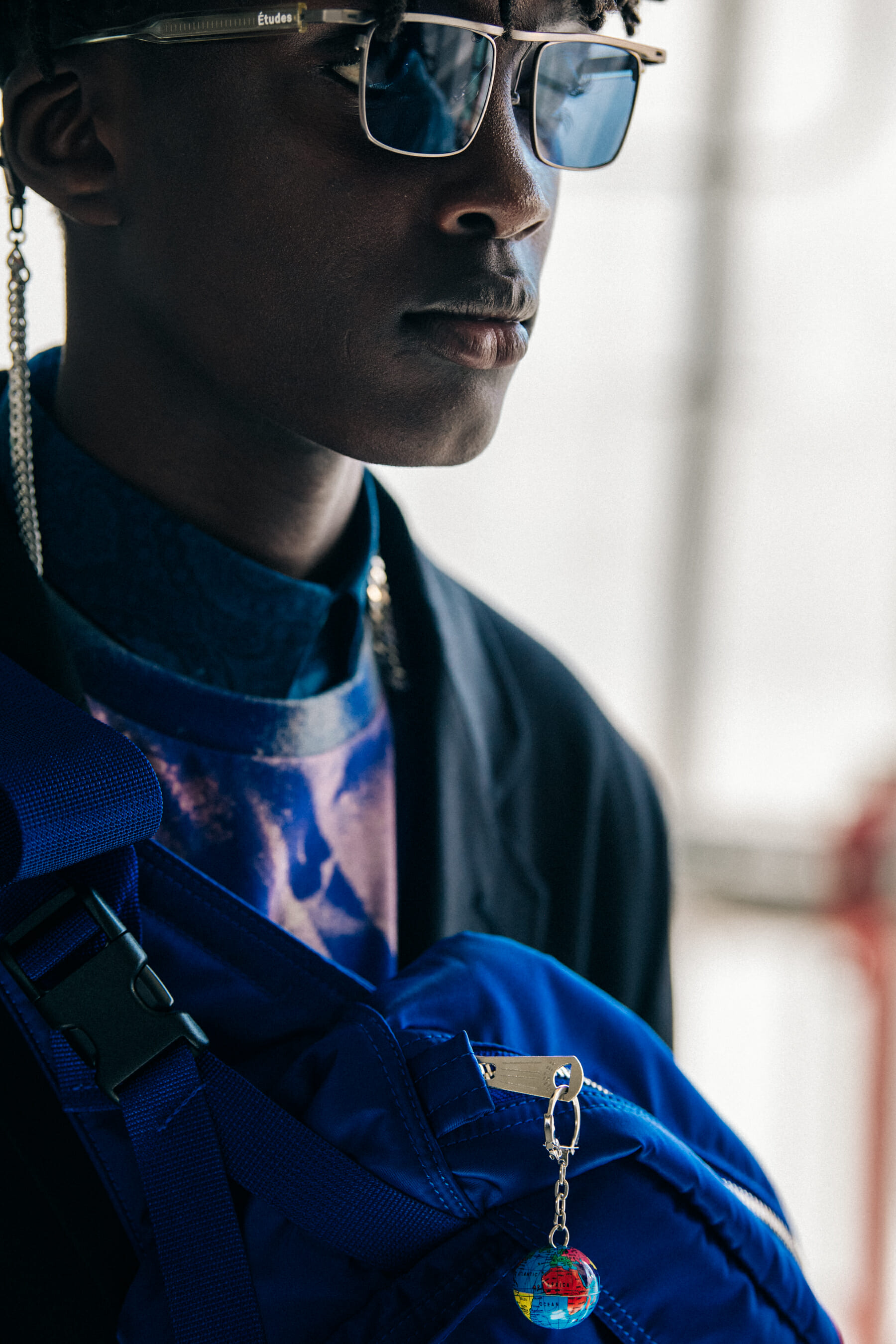 Model wearing sunglasses at Etudes