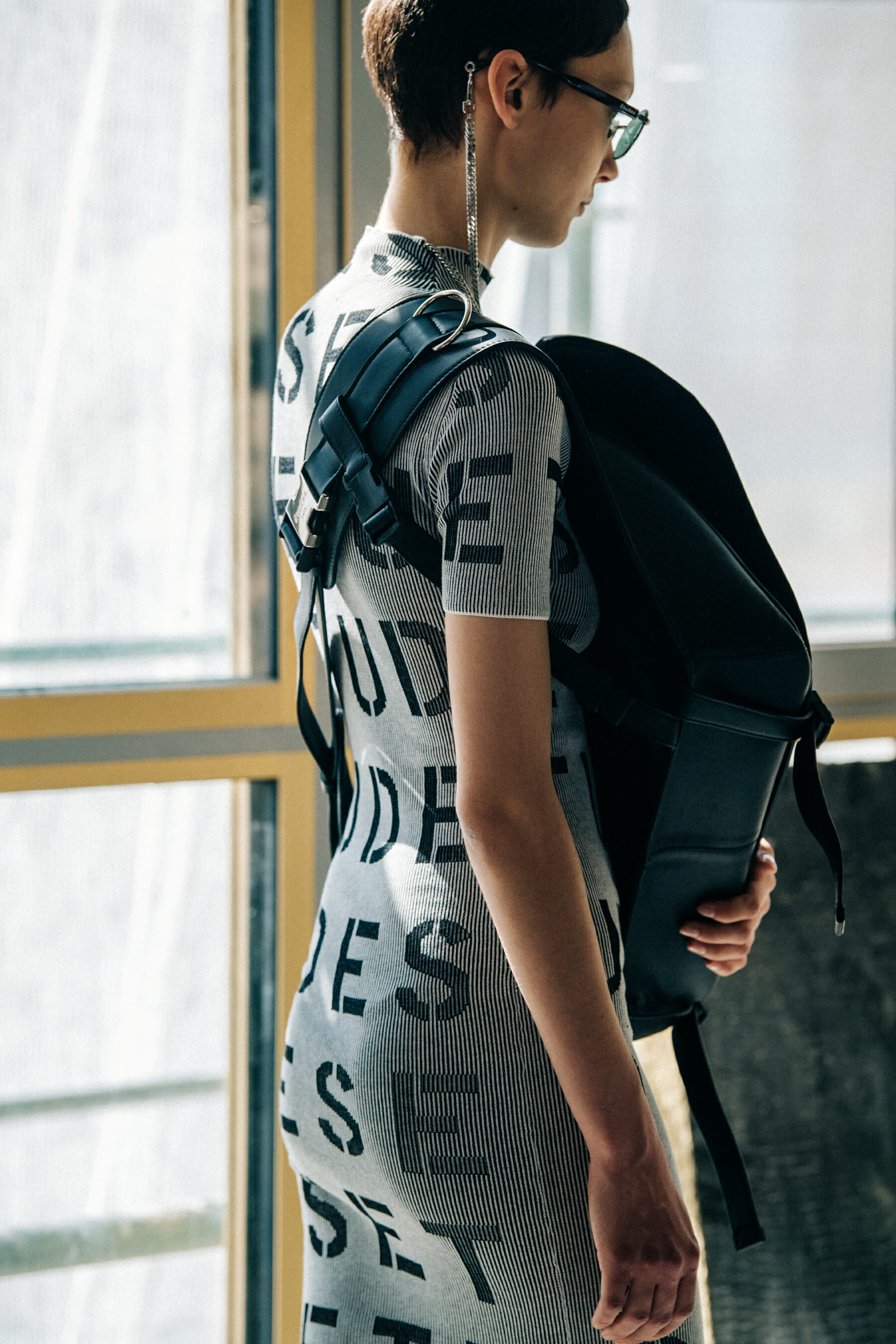Model wearing sunglasses at Etudes