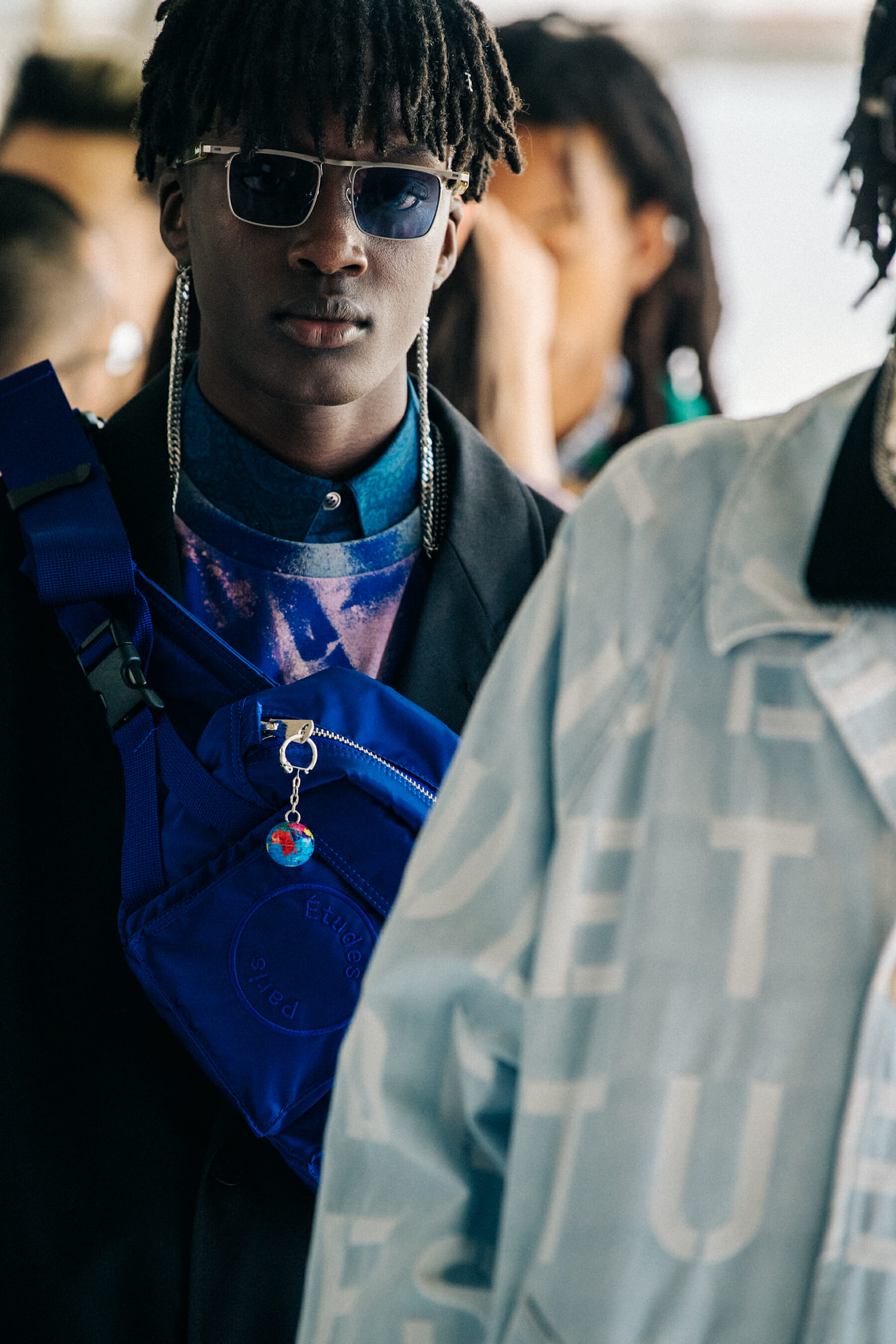 Model wearing sunglasses at Etudes
