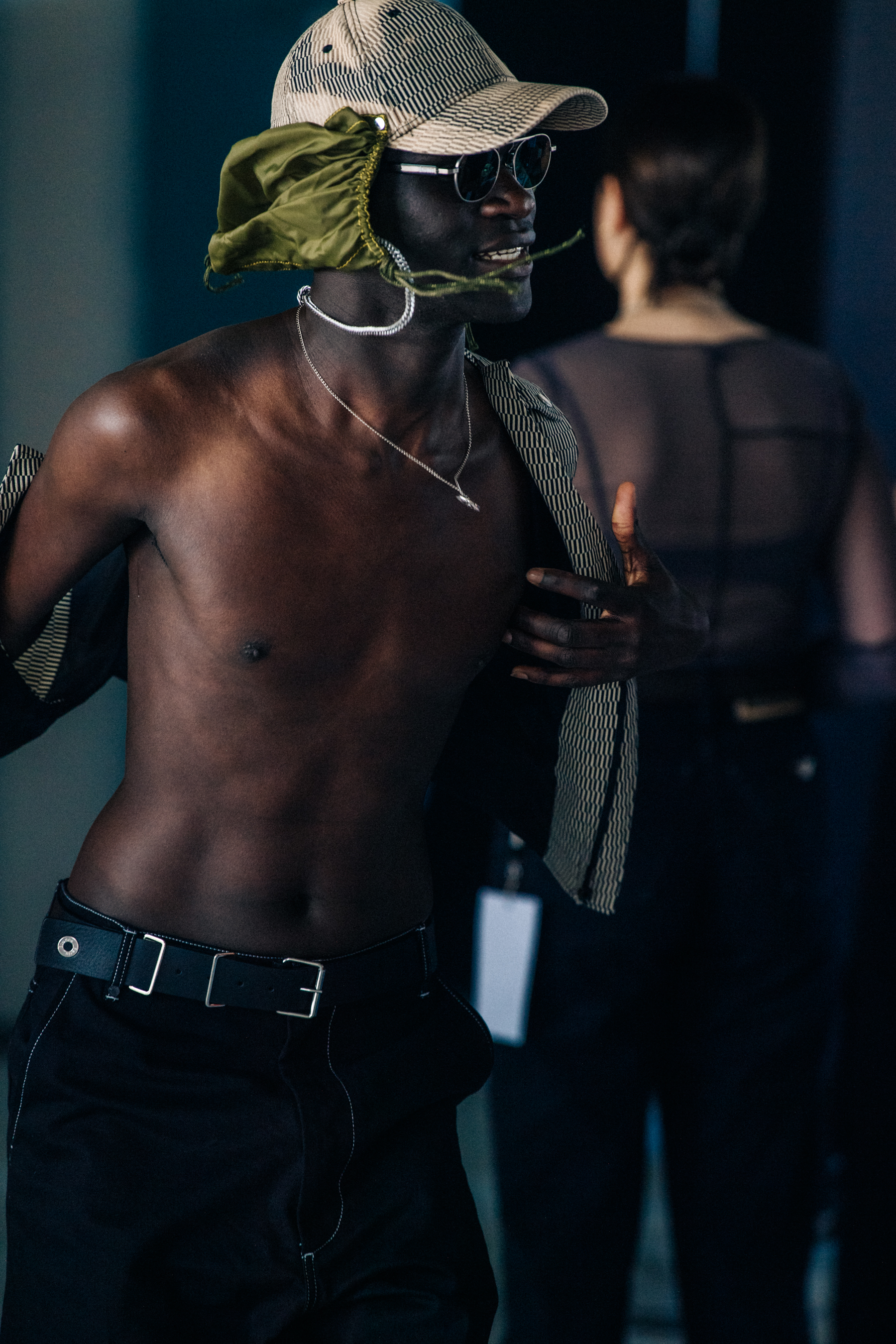 Model wearing cap at Etudes