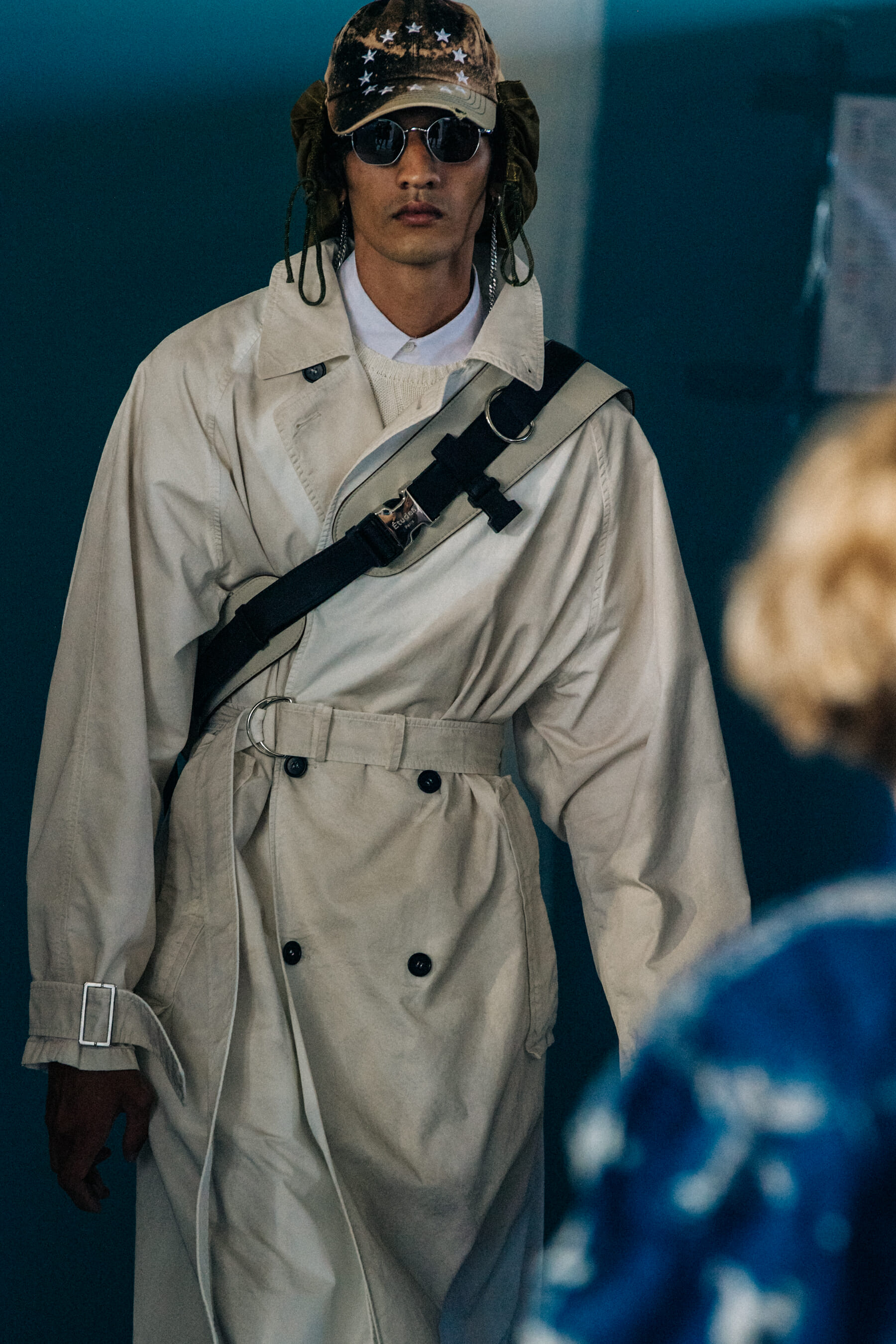 Model wearing cap at Etudes