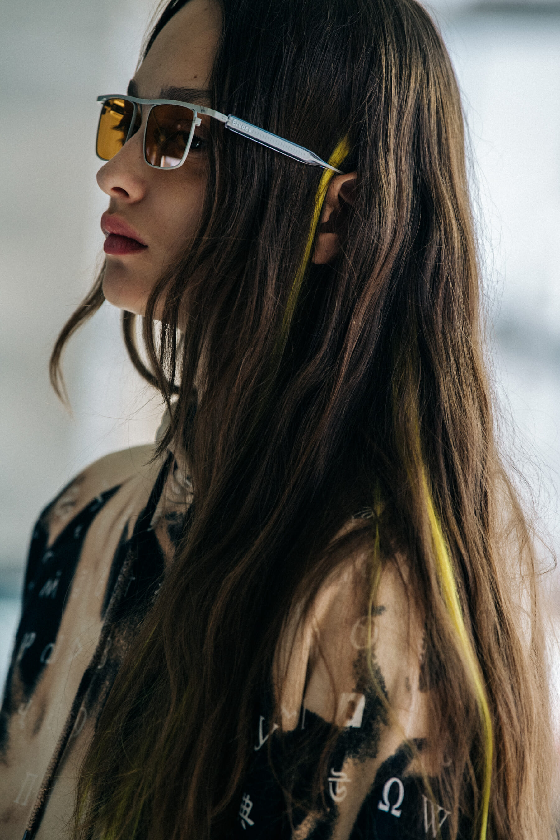 Model wearing sunglasses at Etudes