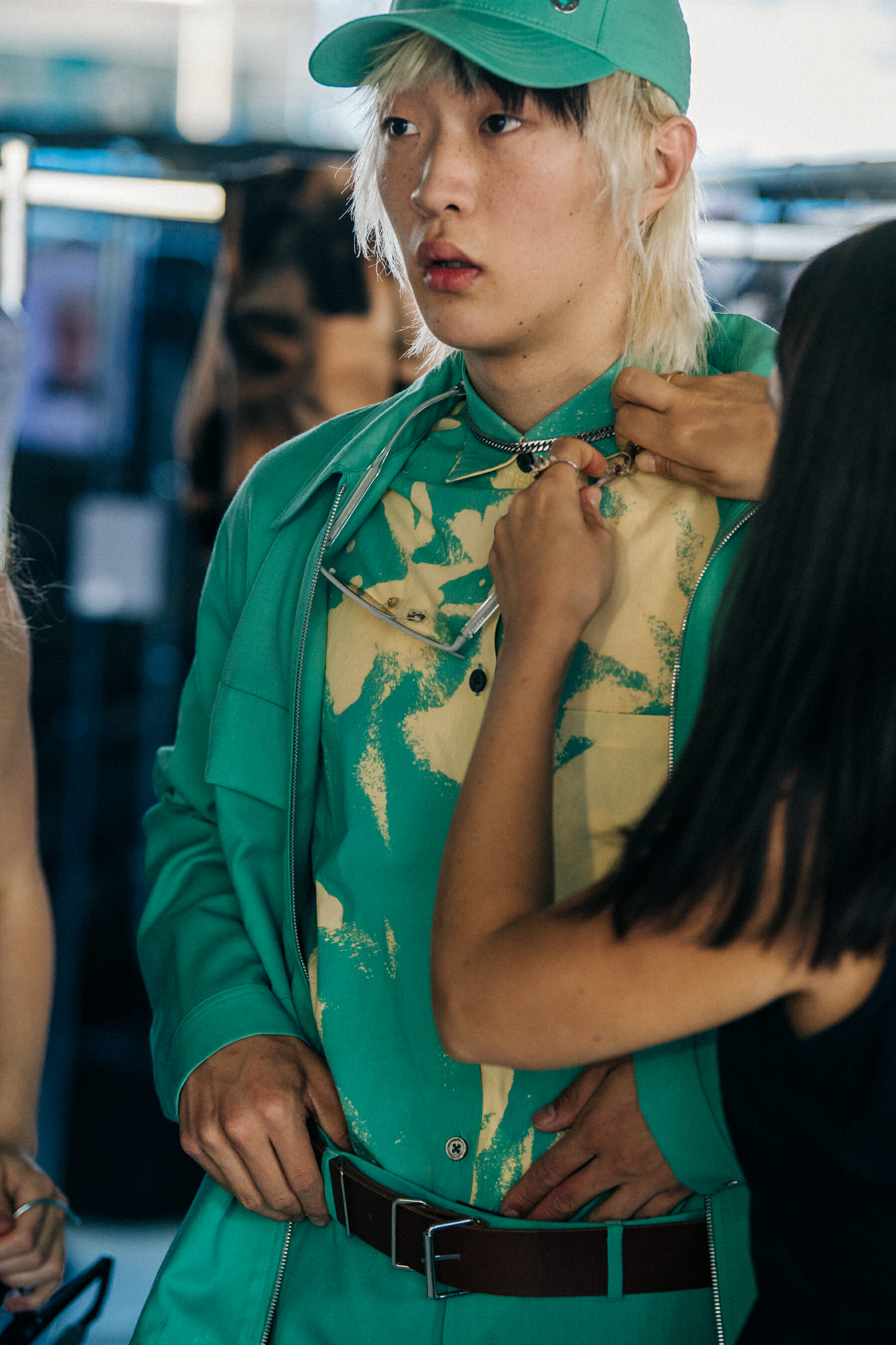 Model wearing cap at Etudes