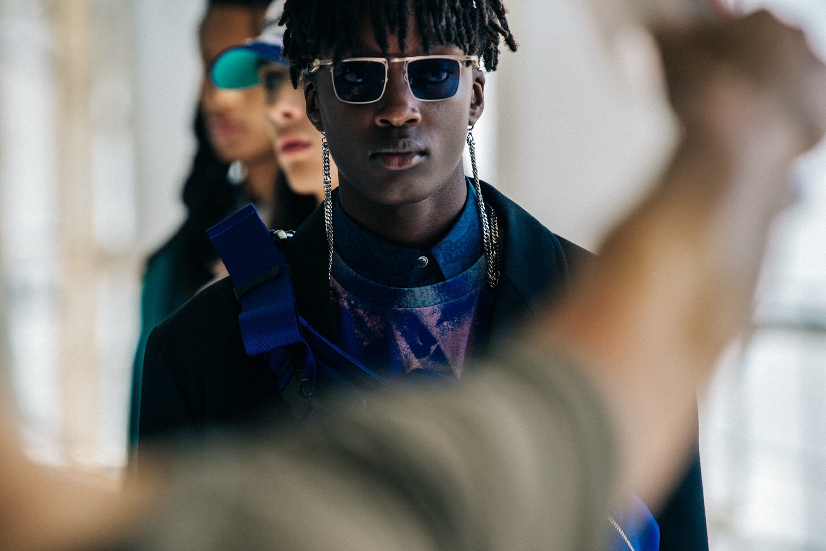 Model wearing sunglasses at Etudes