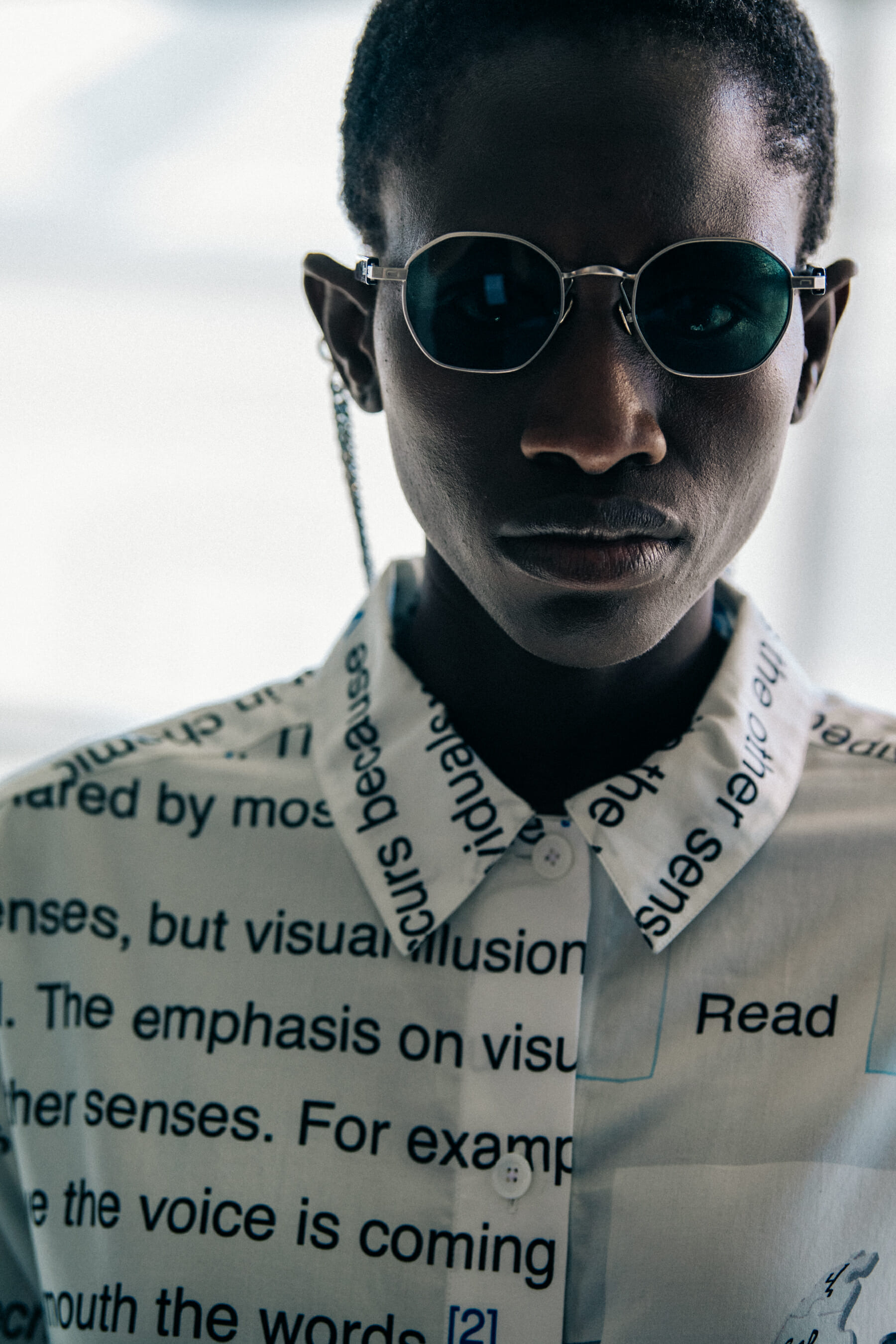 Model wearing sunglasses at Etudes