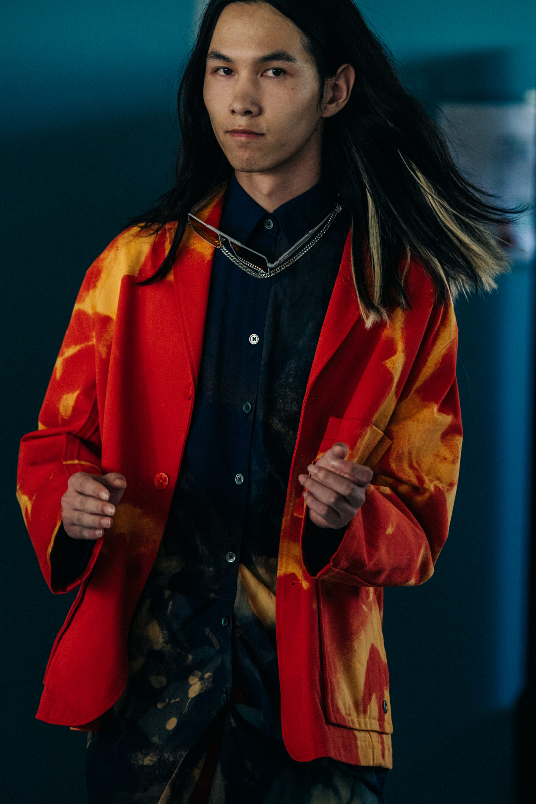 Model wearing red outfit at Etudes