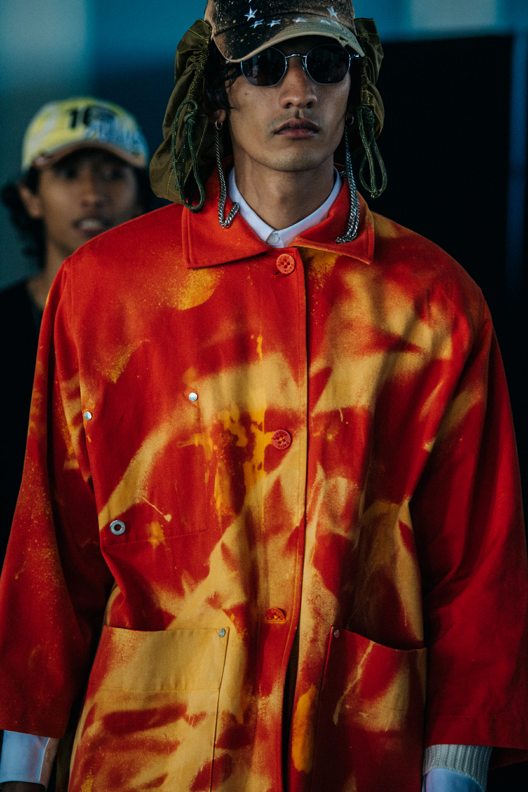 Model wearing red outfit at Etudes