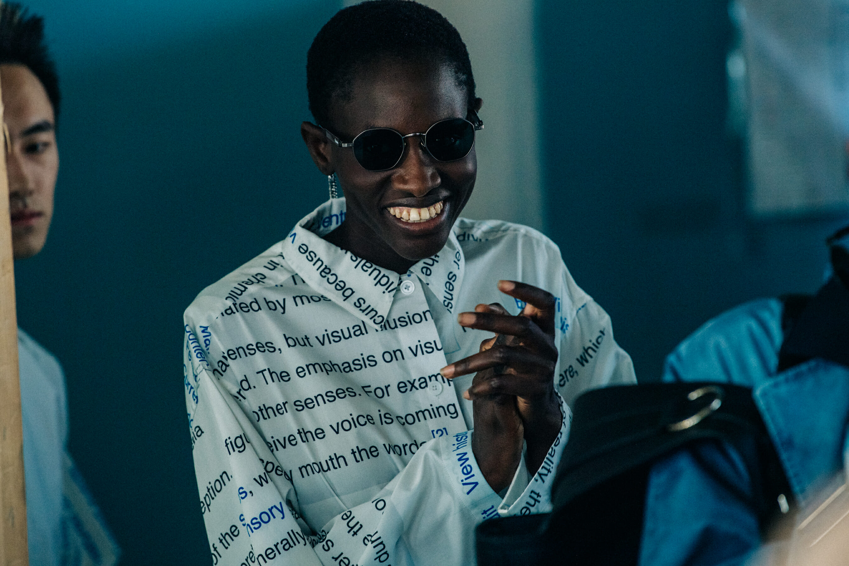 Model wearing white shirt at Etudes