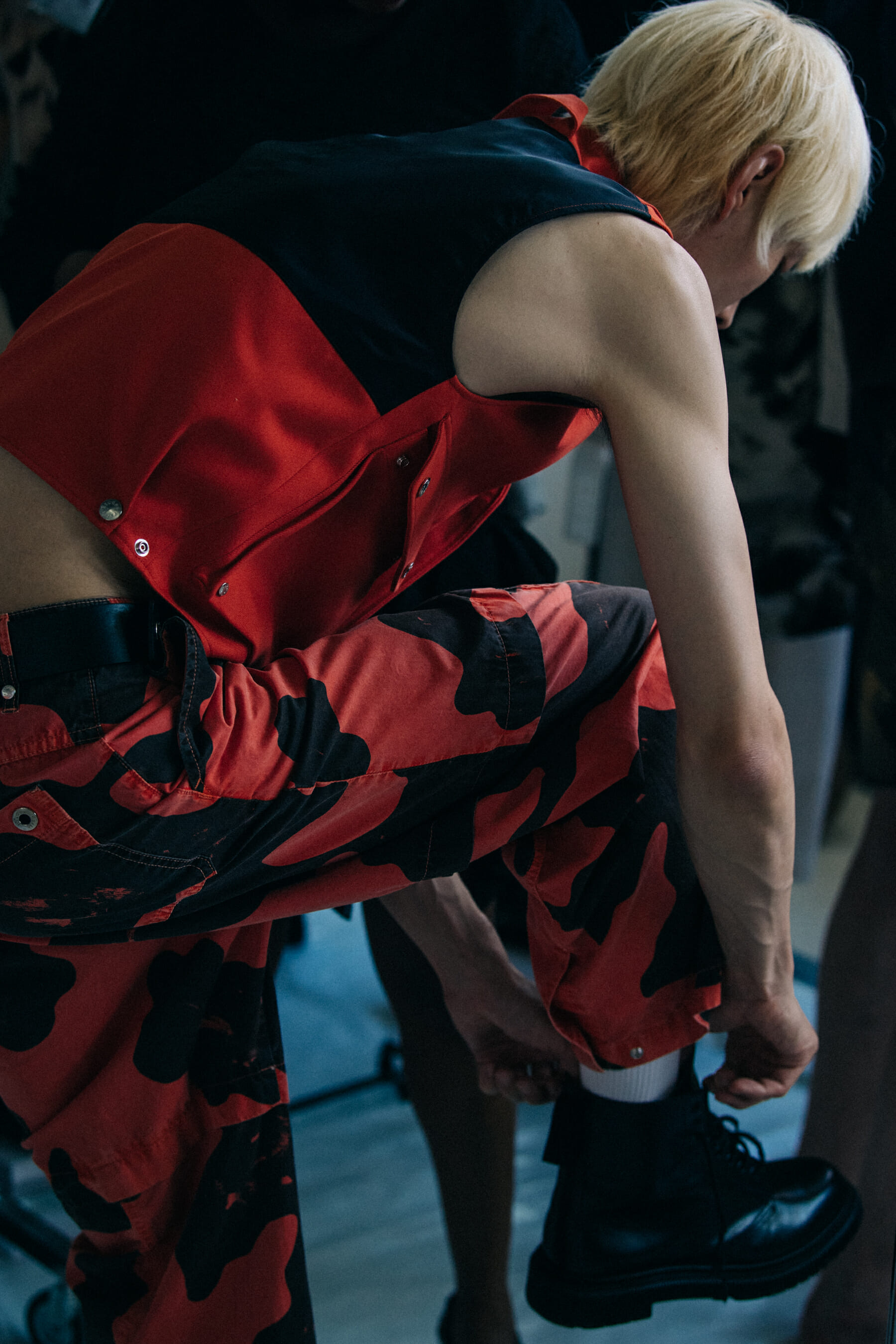 Model wearing red outfit at Etudes