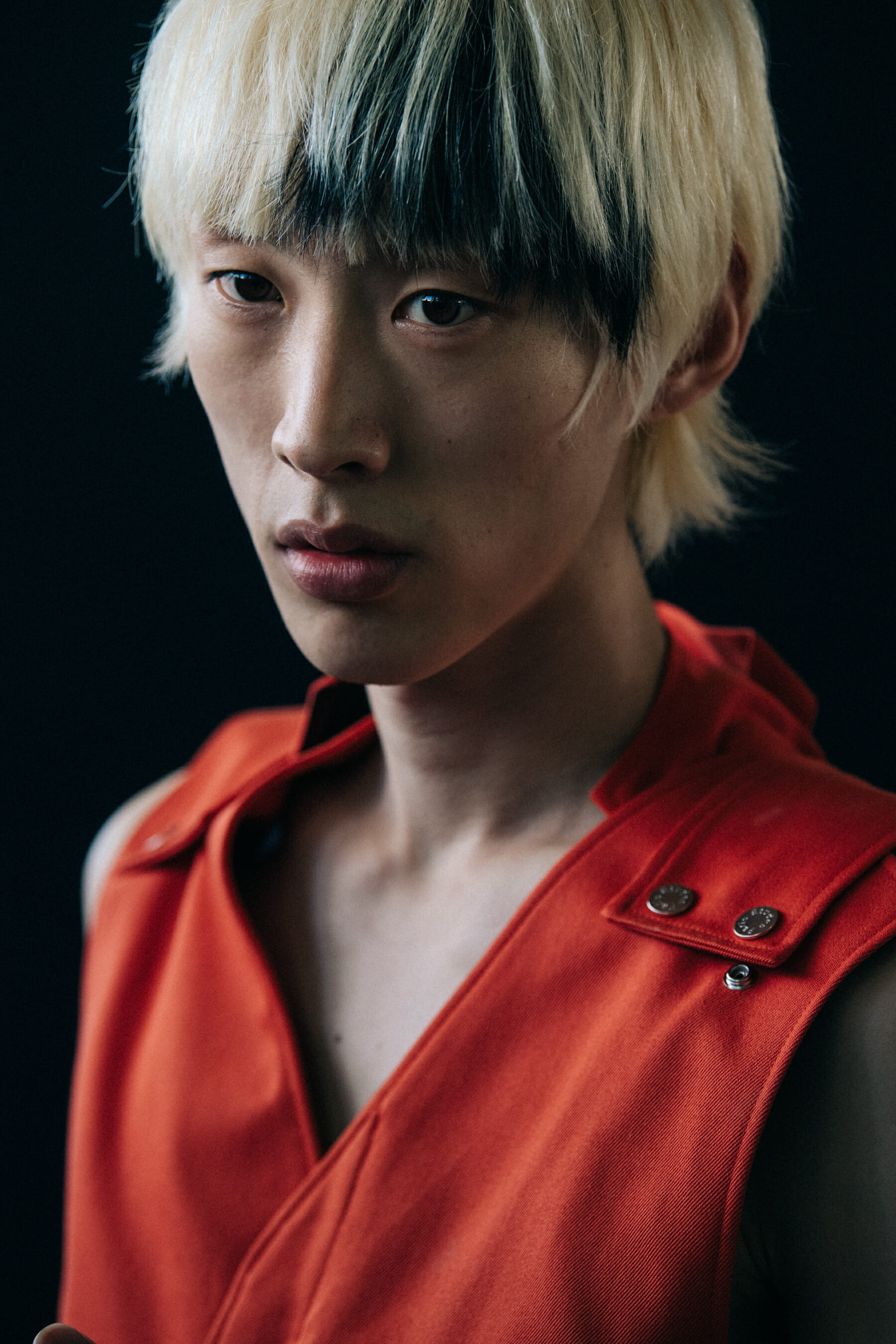 Model wearing red outfit at Etudes