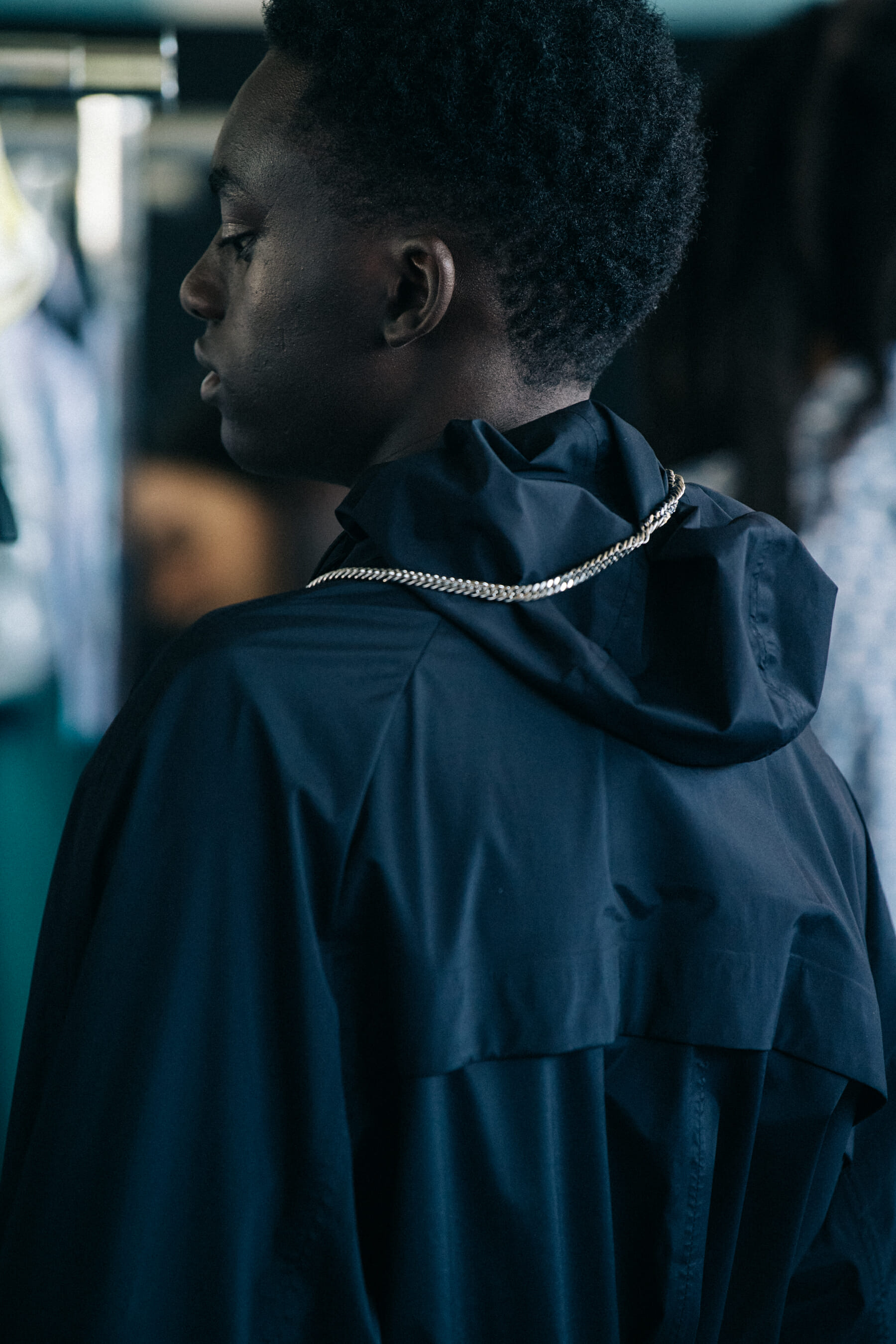 Model wearing dark outfit at Etudes