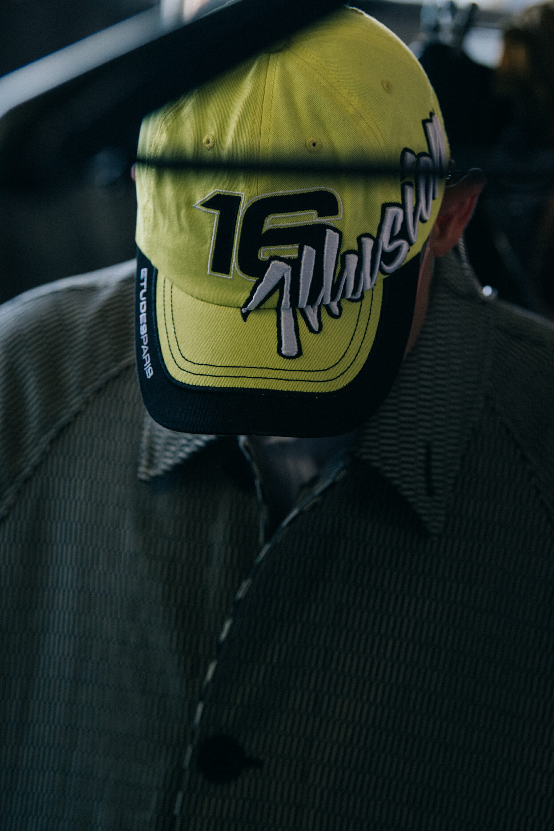 Model wearing cap at Etudes