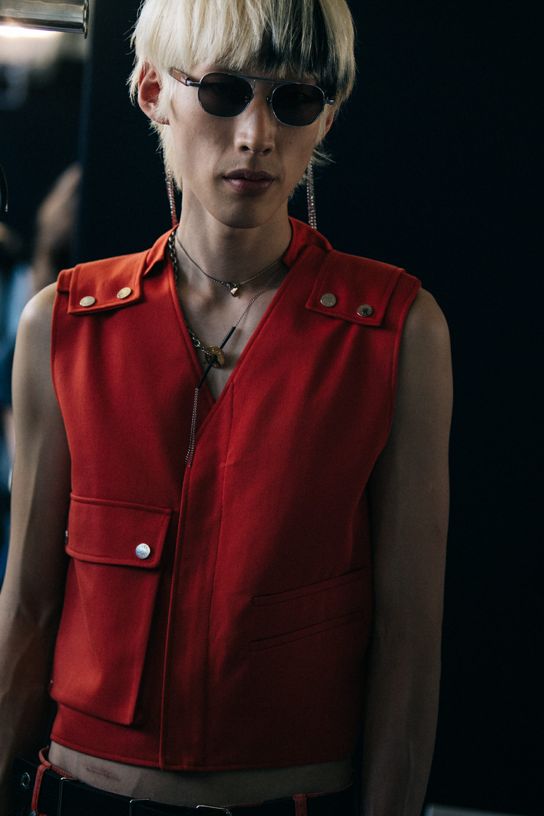 Model wearing red outfit at Etudes