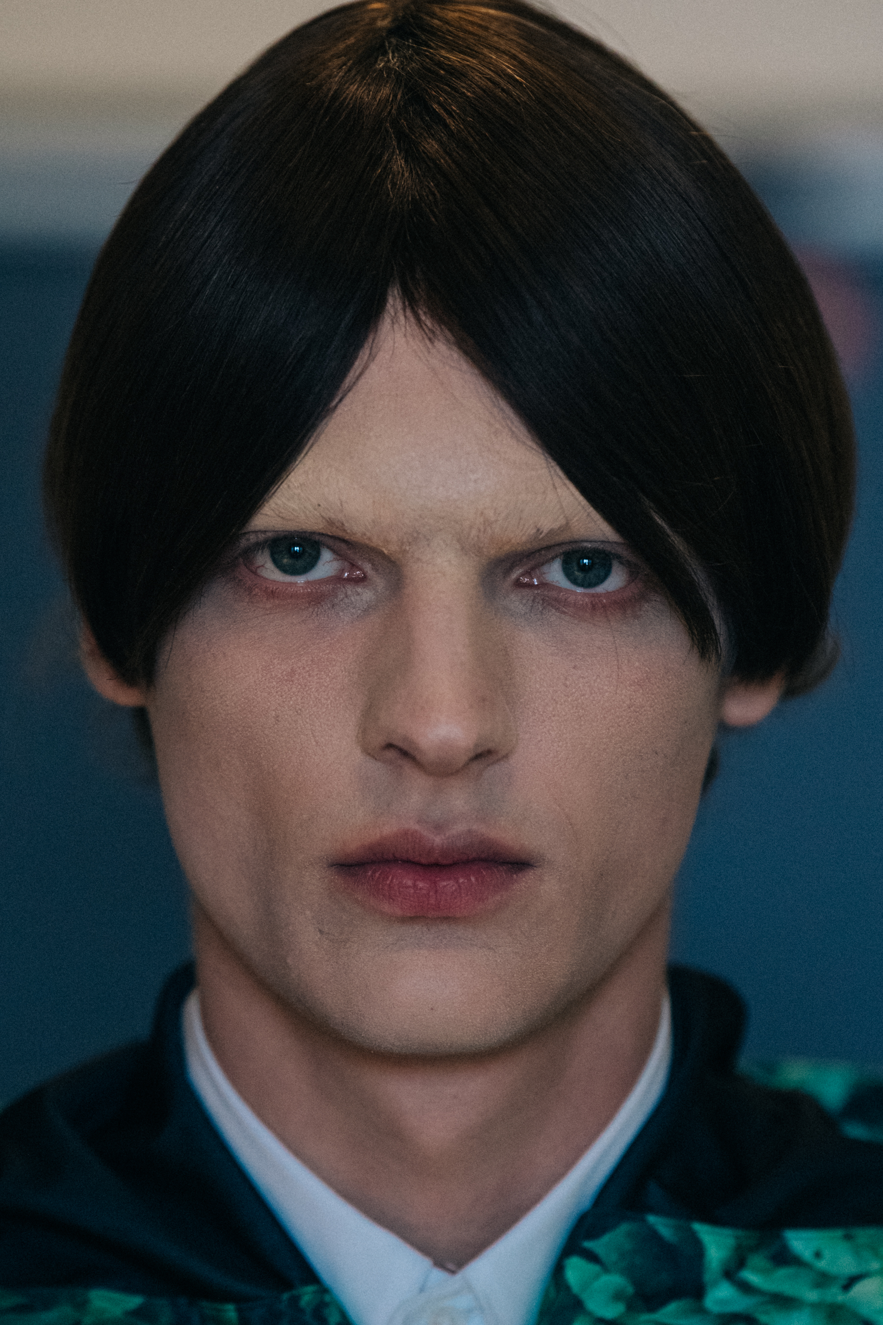 Portrait of model wearing dark wig