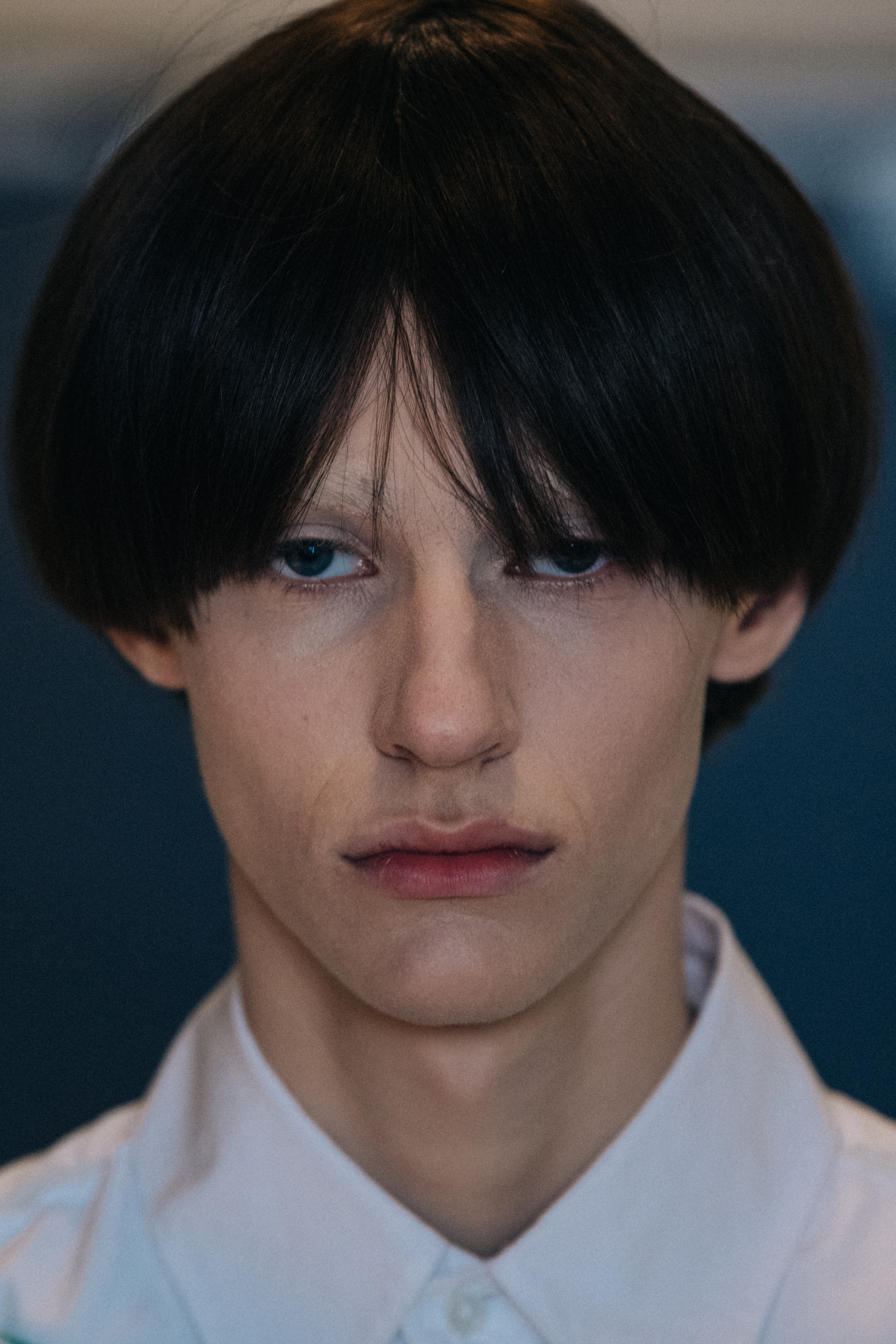 Portrait of model wearing dark wig