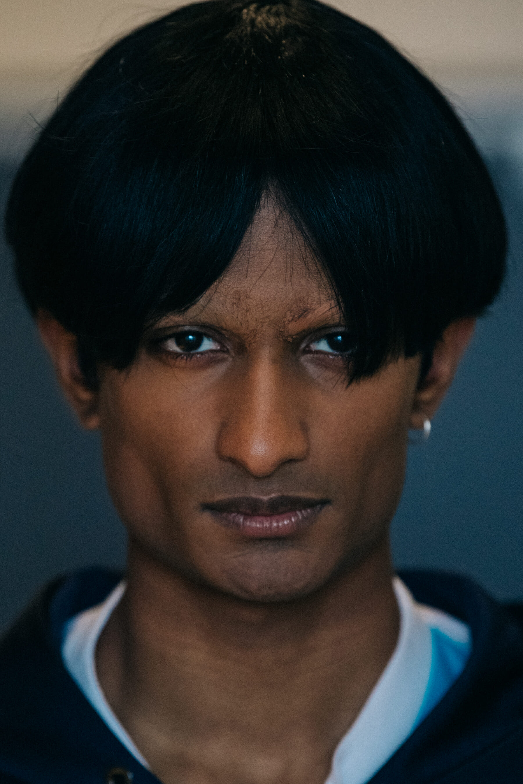 Portrait of model wearing dark wig