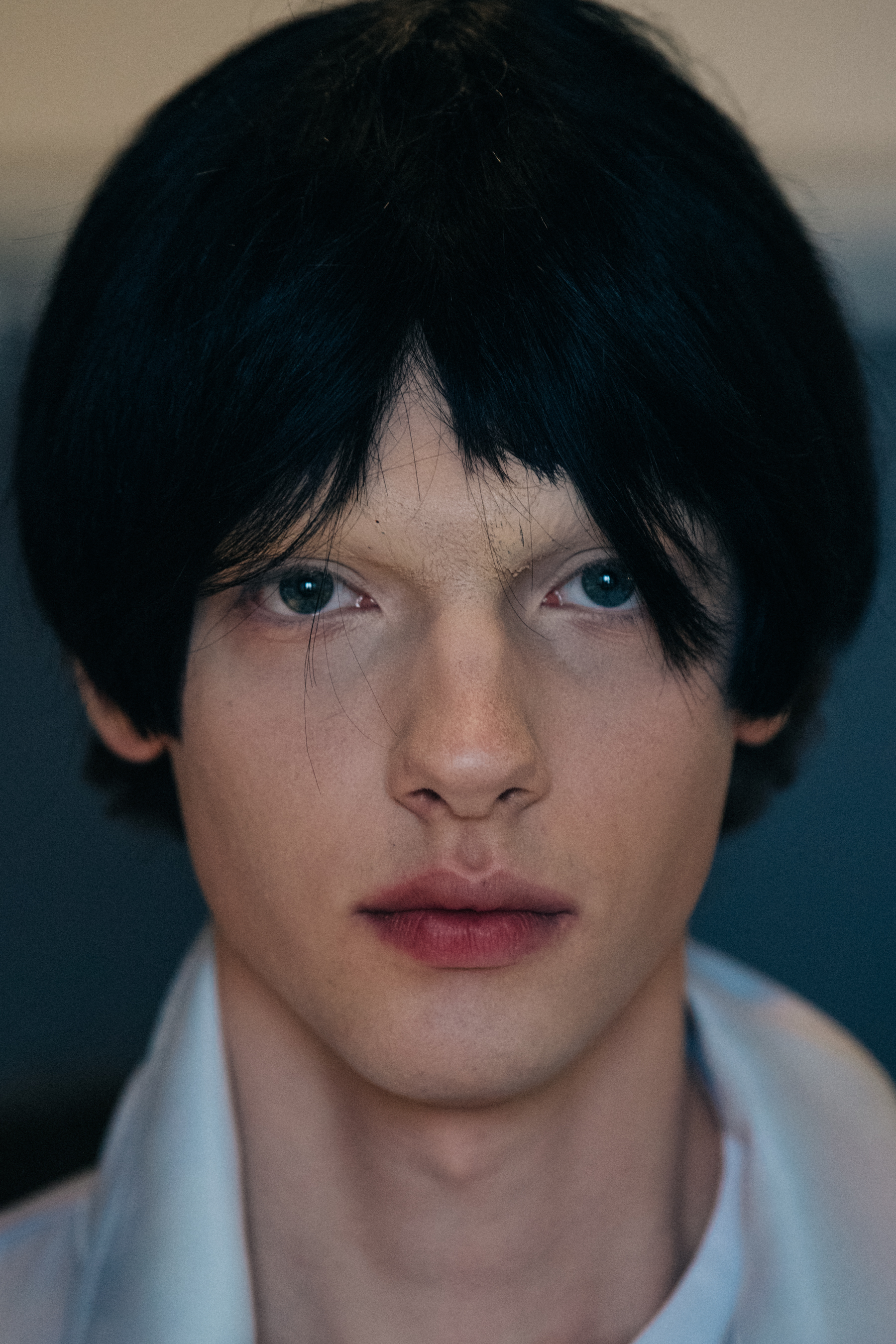 Portrait of model wearing dark wig