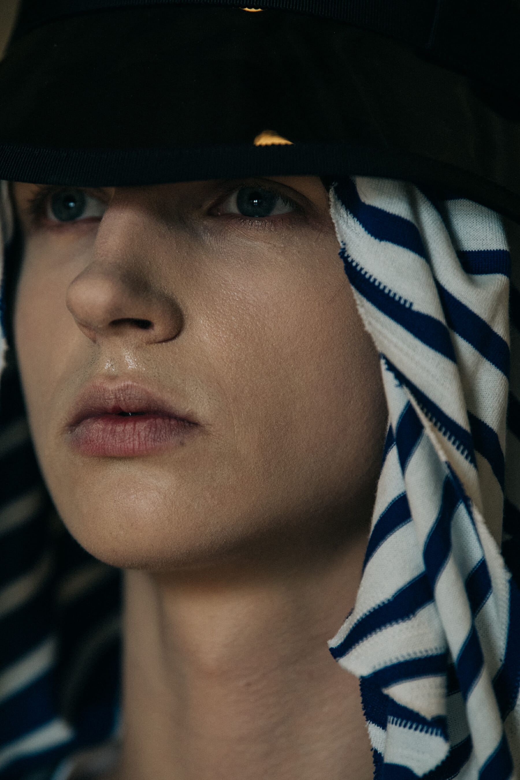 Model wearing straw hat backstage at Fumito Ganyru