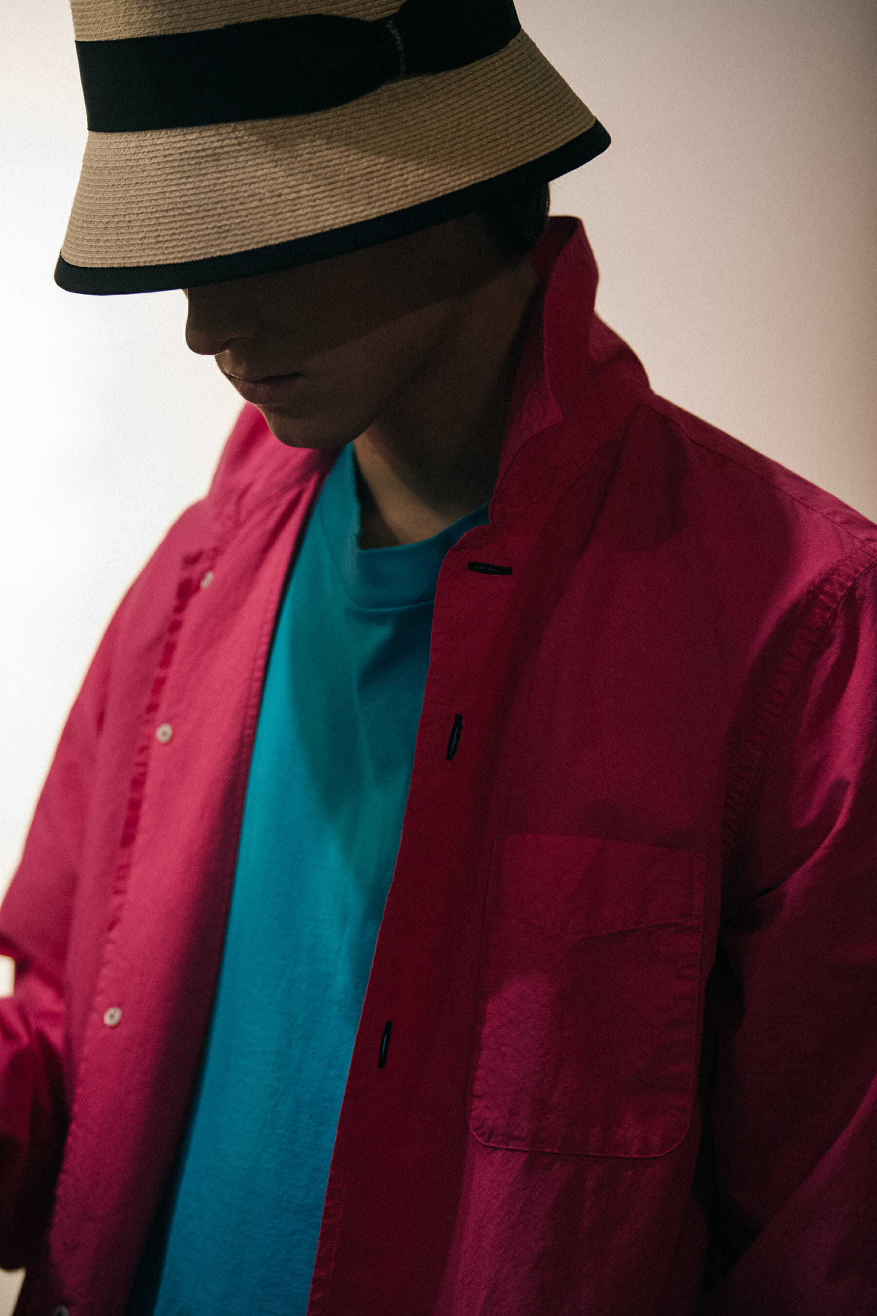Model wearing straw hat backstage at Fumito Ganyru
